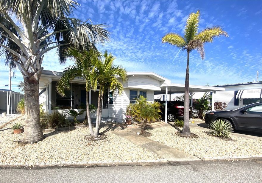 This unique 3-bedroom home in the highly sought-after marina community of Trailer Estates offers a rare blend of modern updates including block structure with vintage charm, making it truly special. Upon entering, you are welcomed by screened lanai, perfect for enjoying the property's Florida landscaping. Step inside the dining area which extends to the living room and you will find an impressive wood-burning fireplace with stunning masonry work creating a cozy focal point—an uncommon yet delightful feature for Florida homes, ideal for winter evenings. The open breakfast bar provides a view into the updated kitchen, which features modern cabinetry, newer appliances, and thoughtful design elements, while still preserving touches of its original vintage appeal. The Terrazzo flooring in the living and dining areas, as well as one of the bedrooms, adds to the home’s character.

This home offers three flexible bedrooms. Ample windows and storage space, makes them ideal for use as bedrooms, a den, or a Florida room to suit your needs. The primary bathroom has been tastefully updated, and a second full bath can be found just outside the main living space. A covered walkway connects the home to not only the second bathroom but also a block laundry room, a utility room, and a workshop area, providing functional space while keeping everything easily accessible. The property has been thoughtfully reinforced with block around the perimeter as well, providing added structural security and ensuring exceptional performance during recent storms. Neither wind nor storm surge from recent storms breached the home itself, emphasizing its resilience and well-planned design. Keep in mind that while there is room for one car under the carport, there is easily room for three vehicles total with two parked in the driveway.

Recent updates include a rubber membrane roof installed just a few years ago, a new washer and dryer, a new hot water heater, six upgraded windows, and a complete replacement of the old iron sewer line with modern PVC piping. The home also has 4 hardwired security cameras. The location of the home is equally impressive, sitting just half a block from the marina, half a block from the channel, and about a block from Sarasota Bay, making it perfect for those who love coastal living.

Trailer Estates is a Special Park and Recreation District, a self-governing tax district under Chapter 418, Florida Statutes. The stated annual tax includes a fee of $1,710.47, covering cable, internet, trash pickup, fire and rescue services, park management, and access to the extensive community amenities. Residents enjoy a marina with rentable boat slips, a private beach and waterfront park pavilion with sunset views, a pool, hot tub, and fitness center, as well as shuffleboard, pickleball, bocce ball, and horseshoes. Additional features include a woodshop, art classes, and nearly 60 active clubs and social events such as bingo, card games, and dances. This exceptional property offers the perfect blend of character, modern updates, and an unbeatable location in one of Sarasota Bay’s most desirable 55+ communities. Property is being sold turnkey furnished minus 3rd bedroom bedframe (sentimental).