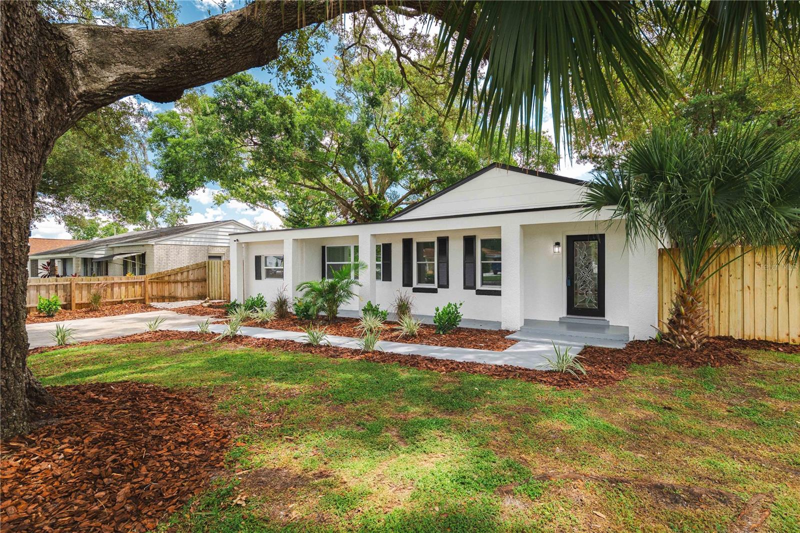Welcome to this beautifully renovated home that checks all the boxes! From the moment you walk in, you'll love the open-concept layout and modern finishes throughout. The kitchen is a showstopper—fully updated with brand-new appliances, stylish cabinetry, and plenty of space to cook and entertain. This home features a new AC (2025), water heater (2025), and a roof installed in 2018, giving you peace of mind for years to come. Every detail has been thoughtfully upgraded to provide both comfort and functionality. Whether you're relaxing indoors or enjoying the spacious yard, this home is move-in ready and waiting for you. Located in a prime Tampa neighborhood with easy access to shops, dining, and major highways—this is the perfect place to call home. Don’t miss out on this incredible opportunity!