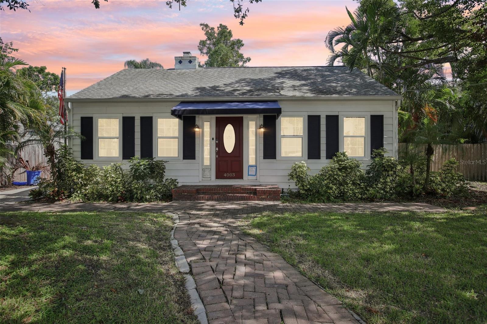 One or more photo(s) has been virtually staged. Welcome to your own slice of paradise in the heart of Virginia Park. This charming 3-bed, 2-bath, plus bonus building, pool home sits on an oversized lot surrounded by brick paver paths, lush greenery, and thoughtful updates inside and out. The refinished original hardwood floors add warmth and character, while a newly remodeled kitchen (2024) with new stainless appliances (2024) and 42" cabinets makes everyday living feel a little more special. French doors lead out to the screened pool area—perfect for coffee mornings or sunny afternoons. The spacious primary suite features custom closets, a double-sink bath, and private access to the pool. The garage has been upgraded with epoxy flooring. A separate 16x16 outbuilding was entirely remodeled in 2025 (flooring, drywall, paint, recessed lights, windows, mini split AC) and could become your dream creative space. New impact windows in key rooms (2025), new washer/dryer (2024), and a garden area that just might make you linger—this home is full of little joys. All this and zoned for great schools! Come take a look and feel the magic for yourself.