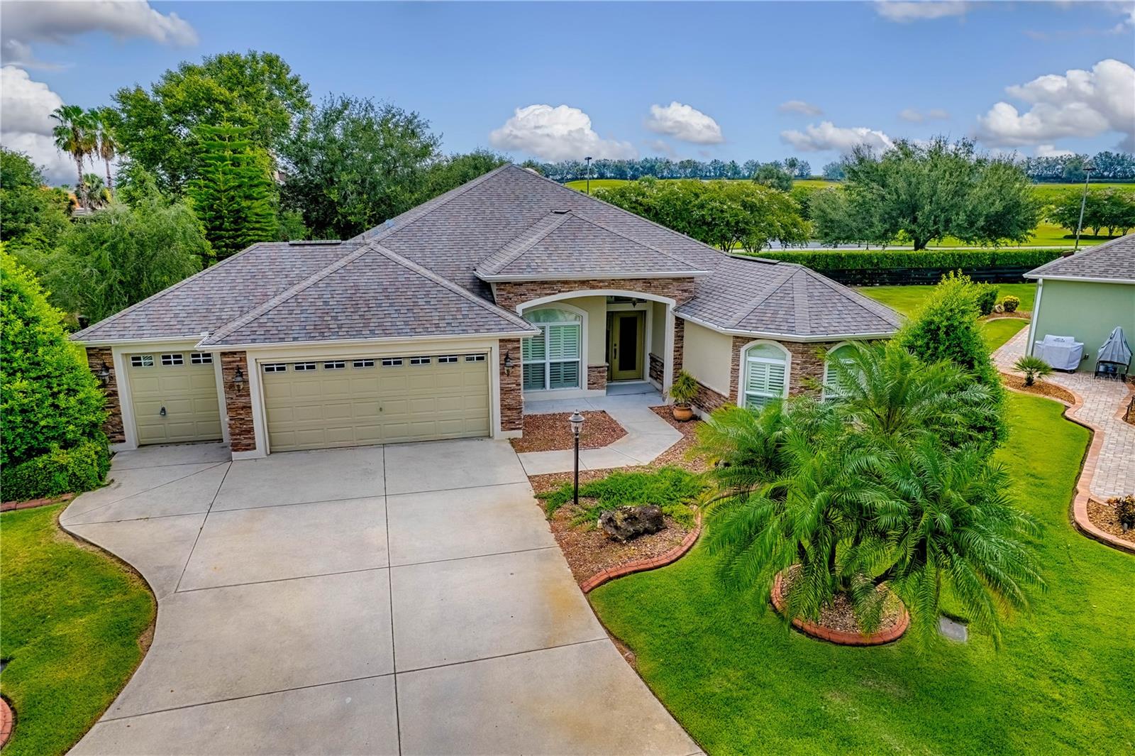 Perfect stretched Gardinia nestled at the head of a cul-de-sac in a picturesque setting. Be close to it all! Minutes to Sarasota golf and practice facilities, shopping on 466A , recreational centers, Brownwood and Lake Sumter Landing. This home includes many upgrades, enjoy no carpet, crown molding, built in arched curio cabinet, no step granite kitchen breakfast bar, updated baths and rear privacy patio.
Oversized enclosed lanai only enhances the special features.
To see it is to love it!