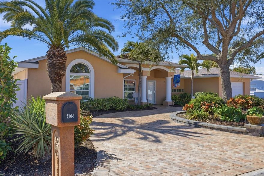 Striking gold in Golden Beach—and move-in ready for the new owner! Impeccable curb appeal is highlighted by lush, custom landscaping and a gracefully curved paver driveway, welcoming you into this refined mid-century, seaside-chic retreat.
Modernized with a coastal flair, this distinctive pool home offers approximately 2,000 square feet of character-filled living in the highly sought-after Golden Beach community on Venice Island—just one block from the beach. Tucked into this exceptional neighborhood yet minutes from shopping, dining, and local theater, the location strikes the perfect balance between peaceful island living and everyday convenience.
Beyond its short stroll to the shoreline, the home also enjoys private, deeded beach access complete with parking, a gazebo, BBQ area, benches, and an outdoor shower—ideal for unwinding after sun-soaked days by the water. Association membership is optional; for just $50 per year, residents gain access to beach parking, social gatherings, potluck dinners, Mardi Gras celebrations, and an annual membership directory. Adding to the appeal is easy access to the Intracoastal Trail, which connects to the Legacy Trail and provides a scenic biking route to downtown Sarasota.
Inside, three generously sized bedrooms and two well-appointed bathrooms are unified by tile flooring throughout, creating a clean, cohesive aesthetic. A beautifully designed custom kitchen (with quartz countertops) by Kitchen and Bath on the Isle anchors the home, while plantation shutters bring in that classic coastal feel. The home has been lovingly maintained and is in splendid condition. Impact-resistant doors (pocket sliders) and windows offer durability for coastal living, complemented by thoughtful, quality upgrades including additional attic insulation, a whole-house water conditioning system, a Lennox Pulse HVAC, and a Generac generator—making everyday life comfortable, easy, and worry-free.
Designed for relaxed indoor-outdoor living, the screened lanai features a heated, in-ground saltwater pool with an integrated spa, enhanced by a lighted pergola that creates a resort-style ambiance. Built-in speakers set the tone for entertaining or unwinding, while an enclosed outdoor shower adds a touch of everyday luxury. A custom half wall cleverly conceals the pool equipment and doubles as a striking mural feature. The rear property is fully enclosed with clean white vinyl fencing and gates, offering both privacy and polish.
Completing the property is an oversized 1+ garage AND a fabulous detached 20’ x 12.5’ garage/workshop/storage building with cabinetry, electricity, a garage door opener, and a roof that matches the main home—blending functionality with thoughtful design. 
And for more good news, this home is in Zone X and there has been no flooding.