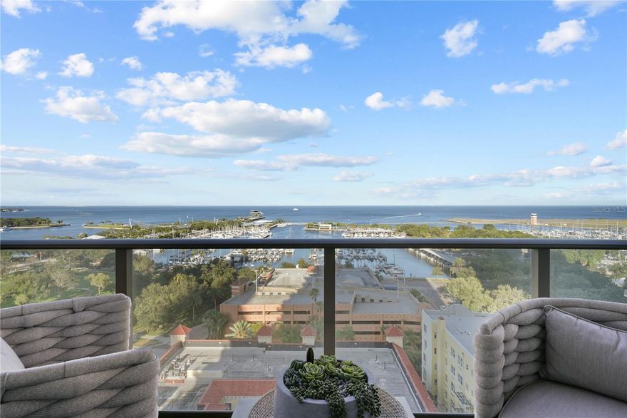 Welcome home to HGTV’s ULTIMATE HOUSE HUNT 2023 FINALIST in the ‘Downtown Dwelling’ category! Built in 2018, this ONE St. Petersburg residence is the epitome of extraordinary luxury design and breathtaking views! The spacious split floorplan featuring two-bedrooms, 3 full bathrooms, a den, and over $100,000 in improvements make this condo stand out from the crowd. Upon entering the residence, you will be drawn into the warm ambiance of an elegantly designed home by one of Tampa Bay’s premier high-end designers. You will love the hardwood floors, unique wall coverings, and custom designed lighting creating an ambiance that provides a sense of comfortable relaxation in the large living room with stunning views. Now let’s talk about that view! Beyond the living room’s floor to ceiling impact sliding doors lies a 329 square foot balcony that stretches across the residence, from the primary to the secondary bedroom, with teak/grass flooring. Here you will discover panoramic views of beautiful Tampa Bay, gorgeous sunrises, fireworks, marinas, Albert Whitted Airport, and the yearly Grand Prix! Now back inside. Adjacent to the dining area is a thoughtfully designed cozy den that also can function as an office and comes complete with its own well-hidden full bathroom with a doorway that disappears into the wall. For the entertainer, enjoy the deluxe gourmet kitchen with a large center island, JenAir stainless steel appliances, imported European cabinetry, and quartz countertops. As a bonus, off of the kitchen, is a well-appointed walk-in laundry room that also can function as a butler’s pantry. The primary owner’s and guest’s suites feature beautifully appointed spa-style bathrooms, walk-in closets, and stunning views of Tampa Bay! This condo comes complete with two side-by-side parking spaces and a climate-controlled storage unit (all on the same floor) in the building’s secure garage. ONE residents enjoy world-class amenities that include a state-of-the-art 5000 sq. ft. fitness center, meeting suites, social room, library, game room, 75’ heated lap pool with private cabanas & spa, outdoor kitchen with four grills, two fire pits, and on-site concierge! The ONE’s premiere location, in the heart of downtown St. Pete, offers residents unsurpassed walkability to fabulous restaurants, shopping, museums, waterfront parks, entertainment venues, nightlife, cafes, marinas, galleries, the St. Pete Yacht Club, the Vinoy Resort, outdoor markets, sporting venues, the St. Pete Pier, and more! Living at The ONE St. Petersburg offer luxury, relaxation, and convenience just waiting for you to call home. Buyer to verify all measurements and information herein.