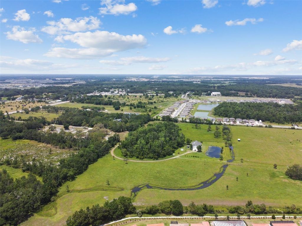 Photo of 12345 Parrish Cemetary Road, Parrish, FL 34219 (MLS # A4569848)