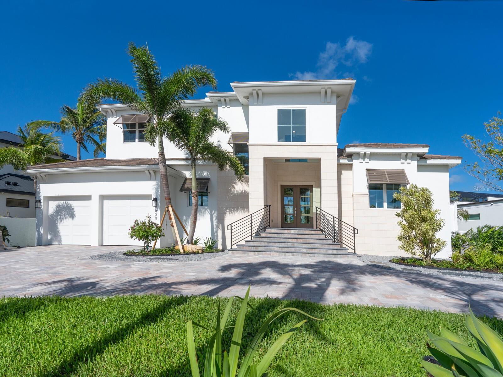 Located in the high-demand waterfront community of Bird Key, this brand new elite home of luxury will impress with
excellence in craftsmanship and eye-catching amenities at every turn. The award-winning team at Allegra Homes introduces the handsome twostory 3,461 sq. ft. “Sorrento” that exudes sophistication from concept to creation. A significant ambiance of beauty and charm invites exploration through an enticing foyer entry that opens to stunning interiors and amazing architectural details enhanced by natural light throughout. There are a variety of interesting nuances sure to please in this 4-bedroom, 4.5 bath home with bonus and media rooms. The magnificent great room features a 22-ft. beamed recessed ceiling and entertainment wall, and is open to a dining room with built-in buffet and wine fridge and an outstanding island kitchen with premium appliances and all the culinary items needed for delightful meal preparation. The covered poolside dining/living area with top-of-the-line outdoor kitchen is perfect for memory-making moments with family and friends. In addition to the outdoor living area, the pool screen encloses the heated pool and spa to create a beautiful oasis to be treasured and enjoyed. Open up one wall in the bonus room and you have additional indoor/outdoor space for entertaining. There’s an adjacent pool bath for convenience. The enormous first-floor owner’s suite is separate from the rest of the house and offers the ultimate personal retreat with double walk-in closets and a glam bath with designer style free-standing tub, frameless glass shower, dual sinks and private water closet. A lovely guest ensuite is also located on the first floor. Upstairs are 2 bedrooms, 2 baths and a generous media room. The gorgeous winding staircase is enhanced with metal railing adding a touch of refinement and artistic style. Additional features include an elevator shaft; natural gas cooktop, grill, water heater and pool heater; epoxy finished 2-car garage; professional landscaping and irrigation well; impact windows and doors; paver drive/walk and much more. Membership in the Bird Key Yacht Club offers a marina, dock rental privileges, casual and formal dining, clay tennis courts, and a deck for watching the boats traveling through New Pass. This exclusive guard-gated enclave boasts 510 homes in one of the most prestigious residential areas on Florida’s West Coast and is within minutes to Lido Key beaches, world-class St. Armands Circle, and exciting downtown scene. Live in the home of your dreams in a coveted central location where every convenience is easily within reach. Simply the best of the best!