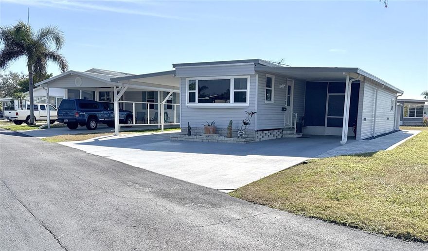 This is a must see property! This 2 bed/2 bath totally remodeled 936 sq ft home located on large corner lot and close to community waterfront park is for the buyer who appreciates quality features at a low price. No flooding in 2024 storms! The owner spent 2 years refurbishing the property and the features are many: the beautiful chef's kitchen has large island, new wood cabinets, white appliances, and filtered water at sink; beautiful luxury vinyl water proof flooring throughout with baseboards and new subflooring; drywall with designer paint, canned ceiling lights; split bedroom floor plan with guest bedroom and ensuite bath with walk-in shower; primary bedroom with ensuite bath that has walk-in shower, hands free smart toilet that opens upon entering and walk-in soaking tub making this a relaxing retreat. Large utility room with washer and dryer and room for storage. Conveniently spaced pocket doors in guest and primary baths and hallway creates privacy without giving up space. Large shed that opens to storage area that could be finished into a Florida room. Major components: 2023 vapor barrier. 2023 central HVAC system. 2024 energy efficient tankless water heater. 2024 irrigation system and paver sidewalk around home. 2023 engineered second carport and concrete in front allowing for 5 vehicle parking. Roofover for peace of mind. Price includes share for the lot and ownership in the Co-op. Home is located on corner lot with lots of green space and is a short stroll to waterfront community park to watch the dolphin and manatee. Found in popular 55+ community of Americana Cove, which is only 10 mins from downtown St Petersburg, 20 mins to two airports and 3 mins to 4th St dining, shopping and grocery. Low monthly maintenance fee of $380 includes water/sewer, trash pick-up, lawn mowing, 24 hr manned gate, private streets and all amenities including clubhouse, heated pool, fitness center, billiards and welcoming residents! 2 pets (dogs or cats) up to 35 pds each are welcomed. Make this home a full time residence, winter retreat or investment property as renting is allowed with 2 month minimum. Management requires 675+ credit score for each buyer. Retire in class with this beautiful property!