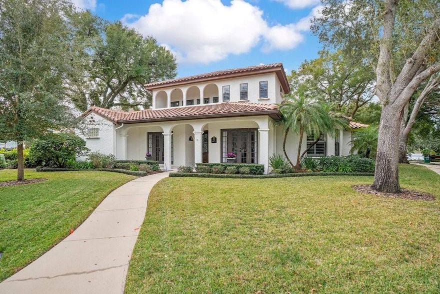 Nestled in the QUIET, oak tree lined and GATED community of LAKE SYBELIA COVE, this CUSTOM-built TUSCAN-style home offers a respite from the outside world and over 3,000 sq. ft of incredibly beautiful and tranquil living space along with the convenience of daily walks around Lake Sybelia. This IMMACULATE 4-bedroom, 3.5-bath residence features thoughtful design and QUALITY CRAFTSMANSHIP throughout. The GOURMET KITCHEN is equipped with custom cabinetry, granite countertops, an onyx backsplash, a GAS cooktop, and stainless steel appliances, including premium additions like a Viking FRENCH DOOR wall oven, Wolf steam oven, and Bosch dishwasher.  On the main floor, the primary suite provides convenience and privacy, along with a second bedroom and full bath. Upstairs, two additional bedrooms each open to private BALCONIES—one offering an impressive VIEW of LAKE SYBELIA. Elegant tray ceilings with crown molding accent the living room, dining room, and primary bedroom. Marble tile flooring flow seamlessly throughout the home, complemented by red oak stairs with wrought iron railings and wide 7.5-inch baseboards. Built for comfort and efficiency, the home includes a RADIANT BARRIER for energy savings, foam-insulated masonry walls on the first floor for better insulation and sound reduction, a whole-house water filtration system, and a GAS water heater. Outdoor spaces include a screened back patio, updated balconies with new drains and flooring, front porch pavers, French drains, and gutters on both the front and back.Recent updates ensure the home is move-in ready.  Here are a few of the most recent improvements.  NEW tile roof (2023), Exterior painting (2023), Marble flooring installation (2023), Interior painting (2024), Upstairs and downstairs Carrier heat pump HVAC systems (2024 and 2025).  Additional enhancements from prior years include CUSTOM front doors and Plantation Shutters on all windows. Located in an excellent school district and just 3 miles from the RDV Sportsplex, this home is conveniently close to the dining, shopping, and all the cultural amenities of MAITLAND and nearby WINTER PARK.  Make sure to see the attached video and 3D VIRTUAL Walk Through.