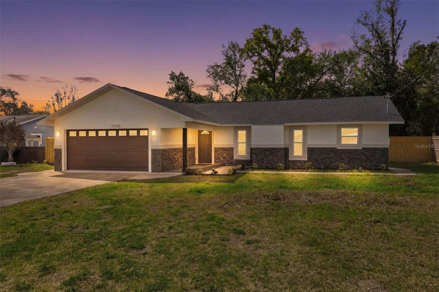 Welcome to the beautifully reimagined 11210 Mercedes St in the heart of Spring Hill! This fully remodeled 3-bedroom, 2-bathroom single-family residence offers 1,664 square feet of thoughtfully designed living space, blending modern style with everyday comfort. From the moment you arrive, you’ll notice the extensive upgrades and attention to detail throughout. Clean cut & tropical style landscape from the moment you pull into the driveway! Step inside to discover a bright, open layout featuring updated flooring and baseboards (2026), a refreshed kitchen with brand NEW cabinets, stone counters & stainless appliances (2026). Large bedrooms and stylishly renovated bathrooms make this the perfect place to call home! Every inch of this home has been enhanced to provide a move-in-ready experience. The spacious 2-car garage adds convenience and extra storage, while the generous living areas make it easy to relax with family or entertain guests. Whether you're hosting friends or enjoying a quiet night in, this home delivers the perfect balance of function and flair. Enjoy the bonus/family room addition off of the back of the home that has tons of natural light and a doorway to the private paver pad & gazebo out back. A secluded backyard to enjoy the Florida outdoors with your loved ones and furry friends. Located in a well-established neighborhood with easy access to shopping, dining, and major roadways, this property is a standout opportunity for buyers seeking quality, comfort, and value. Don’t miss your chance to own this beautifully upgraded home—schedule your showing today! Major updates include: roof (2026), windows & doors (2026), flooring throughout (2026), interior & exterior paint (2026), kitchen cabinets/counters/appliances (2026), bathroom vanities & toilets (2026), and modern fixtures throughout (2026)!