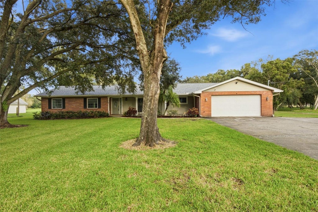 Photo of 17501 Lakeshore Road, Lutz, FL 33558 (MLS # TB8555861)
