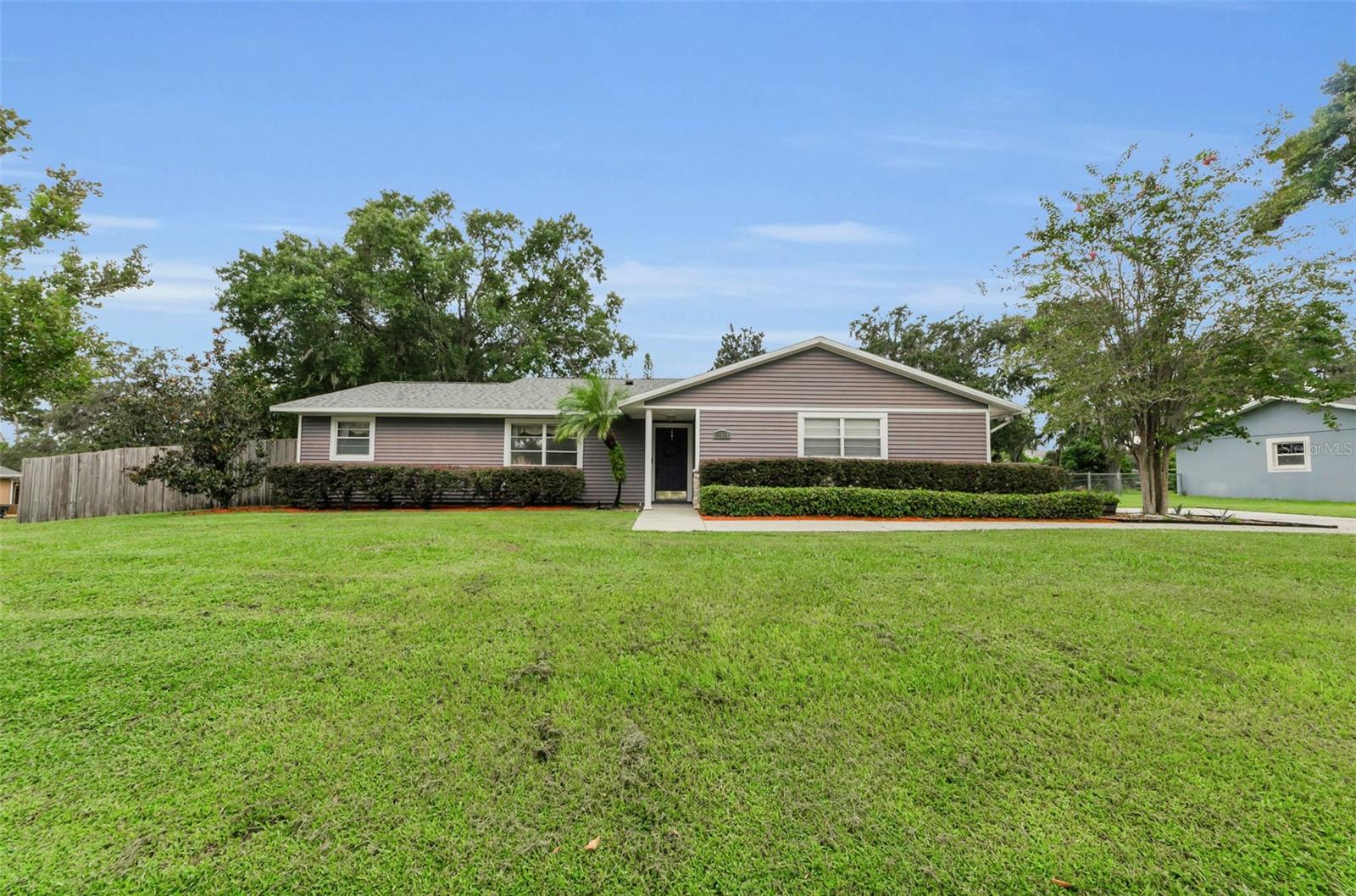 Spacious & Updated Home with Huge Fenced Backyard – No HOA!
Welcome to 11829 Orange St, a beautifully maintained 3-bedroom, 2-bath home offering 1,706sf of comfortable living in the heart of San Antonio. With a prime location just minutes from I-75, St. Leo University, Wesley Chapel, and downtown Dade City, this home provides both convenience and charm.
Inside, you’ll find a split-bedroom floorplan with plenty of space, including two living rooms, a dining room, and a breakfast nook. The centrally located kitchen has been updated with newer cabinetry and appliances, making it a perfect gathering space. A full-size washer and dryer are tucked into an indoor laundry closet with extra storage. The primary suite is a true retreat with a large walk-in closet, a spacious bathroom with a large vanity and a convenient linen closet.
Step outside to a sprawling fenced-in backyard that feels twice its size, complete with lush green grass, a 6' wood privacy fence, a large storage shed and a screened-in porch overlooking the yard—ideal for relaxing or entertaining.
Recent major updates add peace of mind and incredible value: a new roof (2024) and new HVAC (2025). Best of all, this property has no HOA and no flood insurance requirement.
With its spacious layout, modern updates, and unbeatable location near new developments, restaurants, shopping, and easy commuting to Tampa, this home truly has it all. Don’t miss your chance to own this move-in ready gem in one of Pasco County’s most desirable locations!