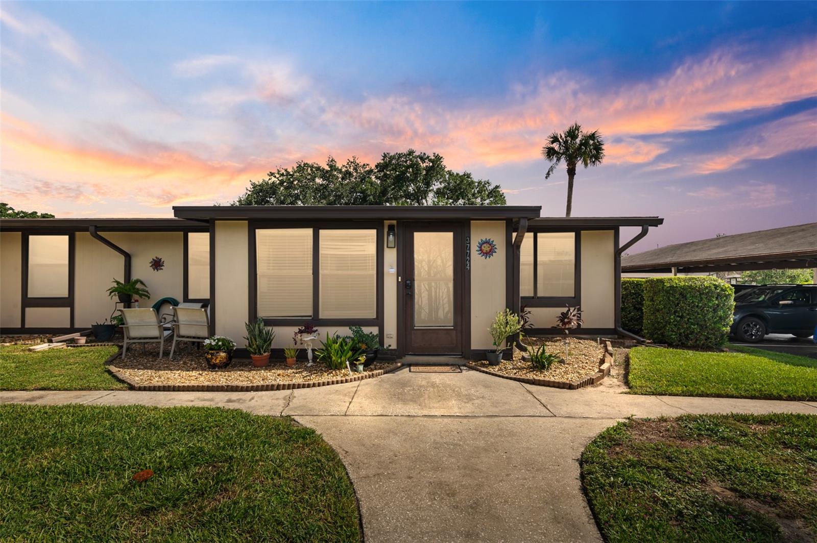 PRICED TO SELL!! Small Gated Community! Right under 1,000 square feet! Completely Updated! Turnkey and Move-in Ready 2 Bedroom, 2 Bathroom One Level CONDO. Located in the Orange Blossom Ranch, 55+ GATED Community. Minutes to downtown Zephyrhills. Upgraded Cabinets, Granite Countertops, Tile, Upgraded Appliances, and Crown Molding all throughout!! Roof replaced in 2017 which is included in the Condo Fees. Covered Carport Parking to keep your car out of the Florida Sun. No carpet anywhere!! Split Bedroom Floor Plan! The spacious living area is perfect for relaxing or hosting guests. Great secondary living space that could be used as a reading room, office, or additional dining area. Very spacious Primary Bedroom with TWO closets. Located within Orange Blossom, residents enjoy access to amenities including a pool, clubhouse, and shuffleboard courts. The low monthly HOA fee covers exterior upkeep, lawn maintenance, and community features. Conveniently close to shopping, medical facilities, parks, and entertainment, this upgraded condo is an excellent value and won’t last long. Don’t miss your chance—schedule a private showing today! Be in downtown Tampa in less than 40 minutes.