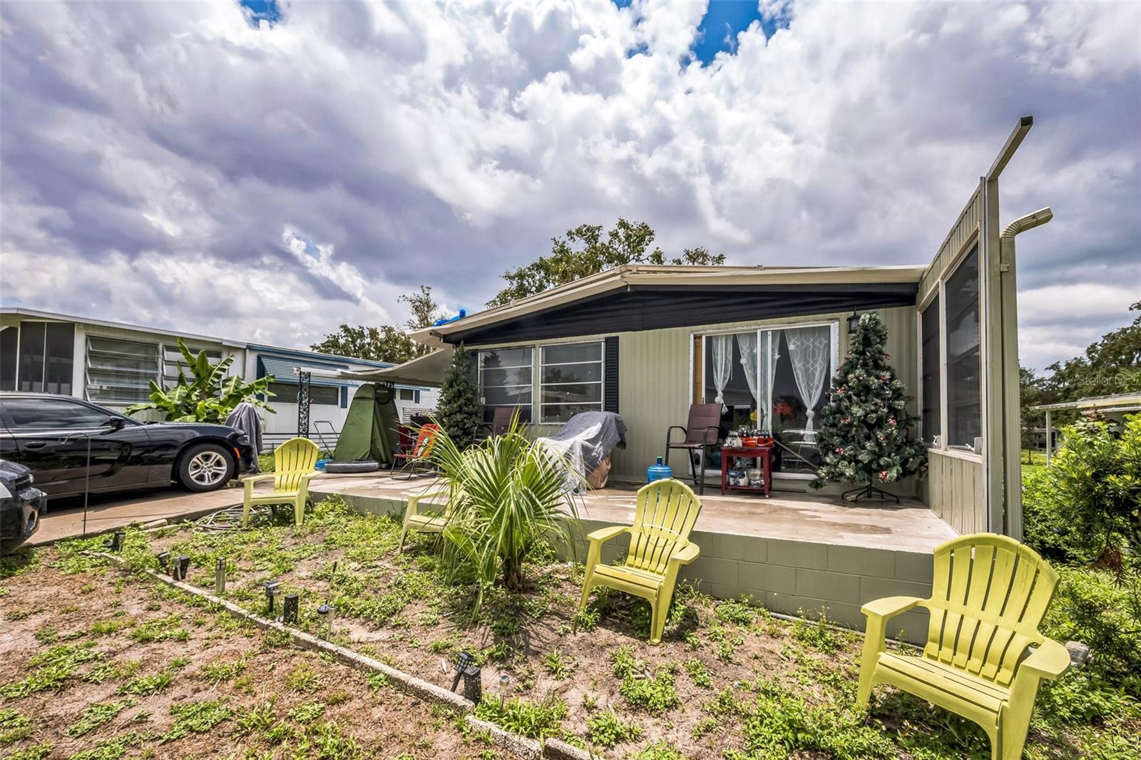 SELLER MOTIVATED! Affordable opportunity in Leesburg! This 2-bedroom, 2-bath manufactured home with land ownership is priced to sell and perfect for investors or buyers looking to build sweat equity. The home is livable as-is but could use some cosmetic TLC to reach its full potential.
With a new roof (2019) and updated AC (2021), the major systems are already taken care of, just bring your vision to refresh the interior!
Spacious layout, attached carport, screened patio, and utility shed offer functional living and storage space.
Nestled on a quiet street with no mandatory HOA and land owned no lot rent, this is a rare find!
Conveniently located just minutes to Downtown Leesburg, The Villages, and US-27 for quick access to shopping, dining, medical facilities, and central Florida’s most popular attractions. Whether you’re looking for a primary residence, rental property, or seasonal retreat, this one has excellent upside.
Cash or conventional buyers preferred. Schedule your showing today this one won’t last long!