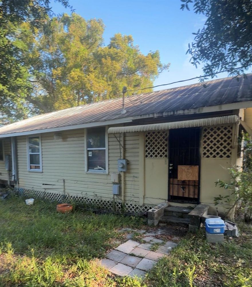 This property presents an excellent opportunity for investors or buyers seeking a fixer-upper. Featuring 3 bedrooms and 1.5 bathrooms, the home offers strong potential as a starter residence or an income-producing rental. With plenty of possibilities to make it your own, the property includes a spacious enclosed front porch, multiple storage sheds, and an additional screened-in wood shed.
Conveniently located near major amenities and commuter routes, with easy access to I-275, the home also benefits from no HOA, no CDD fees, and no deed restrictions. The large backyard adds even more value and flexibility.
The property is being sold as-is, including all existing appliances and systems (plumbing, heating, A/C, and electrical). The seller and listing agent have no knowledge of the property’s history, and no disclosures are available. Buyers and their agents are responsible for verifying all details, including any HOA information, square footage, lot size, room dimensions, and taxes.