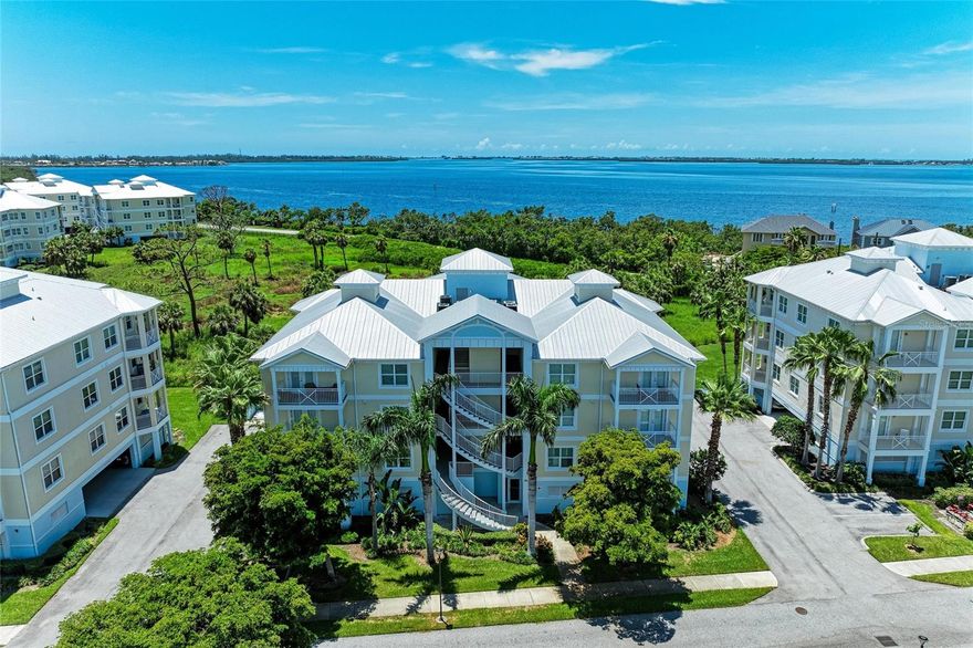 Gorgeous Palma Sola Bayfront condominium in the gated community of Palma Sola Bay Club. This move-in ready Islamorada floorplan shows like a model and offers 1,657 square feet of coastal-inspired living with two bedrooms, two baths, open floor plan with an abundance of natural light, impact hurricane windows, crown molding, high ceilings, 8-foot doors, split bedroom floor plan and interior laundry room with cabinets and sink. The spacious primary suite offers the ideal spot to lay in bed and look out at the beautiful preserves and sunset views that will take your breath away, walk-in closet with custom-built shelving and an en-suite bath with dual sinks, luxurious soaking tub and separate shower. The large kitchen is outfitted with 42-inch ivory solid wood cabinets, soft-close drawers, granite countertops, stone backsplash, island with extra storage, stainless steel appliances with new microwave and under-cabinet lighting. Go outside to the covered balcony to watch the rain come across Palma Sola Bay, boats on the water, soak up the sunshine and bay breezes, and view the wide-open nature preserve. A relaxing way to enjoy your home all year round. Room to breathe, enjoy wildlife, open spaces, sunsets and unwind. Walk across the street to the private Palma Sola Community dock for a morning kayak, paddleboard, cup of coffee, drop a line in the water to fish, or just sit and observe Florida’s amazing beauty! The condominium comes with two assigned parking spaces under the building, one large storage cage in the garage, stairs and elevator leading to your front door. The lifestyle of Palma Sola Bay Club is best described as casual elegance. This graceful bayside community offers a relaxing setting complemented by Key West architecture. Inside the community are 30 acres of preservation land, walking trails, three beautiful ponds with tropical landscaping, dog park and a dock on Palma Sola Bay to enjoy awe-inspiring sunset views. The community clubhouse provides a fitness center, billiards table, gathering and social room and two kitchens. Outside, enjoy a heated community pool with a large deck for lounging and relaxing, outdoor entertainment with a wet bar, bocce ball court, gas grill, fire pit and putting green for golf lovers. The condominium monthly fees include the security gate entrance, cable TV, internet, sewer, trash, water, escrow reserves fund, insurance, grounds and exterior maintenance, manager, pest control, fitness center and recreational facilities. This award-winning community is only minutes from the beautiful beaches of Anna Maria Island, restaurants, grocery stores, post office, golf courses, shopping, parks, nature preserves and historic downtown Bradenton. Rentals are allowed for a minimum of 30 days. Two pets are allowed. Some furnishings are available for sale separately. Schedule an appointment to see this amazing condominium today!
