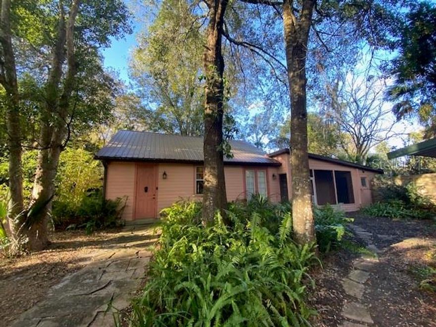 Improved price!! Charming cottage on 1 acre of private and wooded land! A quality custom 900 sq.ft. addition was added to the original 2/1 in 2014 by Bill Fraser Construction. There is a possibility that part of the addition could be used as a 3d bedroom. There are two closets in the addition. Original shingle roof was replaced in 2012 and the new addition has a metal roof, double pane windows and ceramic tile flooring. Well & pump was replaced in 2018. Master bedroom has vaulted ceilings plus a large 6x10 walk-in closet and a separate 7x10 dressing area with sink and vanity. There is room in the master bedroom to add an additional shower/toilet if needed which would make it 2 full baths. The original bathroom has a walk-in shower and vanity. The screened porch overlooks the private and natural walkway to a large workshop with electric and AC unit. Attached is also a covered carport. There is a variety of fruit trees including orange, lemon and grapefruit to enjoy! Enjoy the country feel while still living within 5 minutes to parks, shopping, schools and recreational facilities! Daytona and New Smyrna Beach are only 30-40 minutes away!