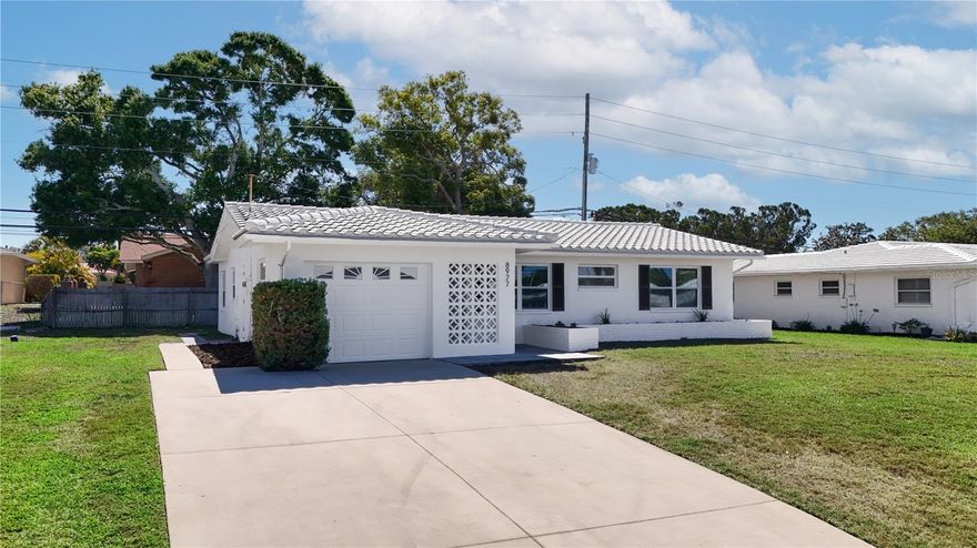 Discover easy Florida living in this beautifully updated 2-bedroom, 2-bathroom single-family home located in the desirable 55+ community of Tamarac by the Gulf in Seminole. This move-in-ready residence features fresh interior paint, durable LVP flooring throughout the main living areas, and a thoughtfully updated kitchen and bathrooms with modern finishes. The spacious kitchen is equipped with stone countertops, stainless steel appliances, and contemporary lighting, all flowing seamlessly into the large living room, perfect for both relaxing and entertaining. A dedicated dining area sits just off the kitchen, offering a comfortable space for everyday meals or hosting guests. Residents enjoy access to community amenities including a pool, recreation facilities, and shuffleboard courts, while the low HOA fee of $240 conveniently covers water, sewer, trash, and grounds maintenance. Ideally situated close to parks, Gulf beaches, shopping, dining, and entertainment, with easy access to downtown St. Petersburg and Tampa, this home also offers peace of mind by being located outside of a flood zone. Don’t miss your opportunity to enjoy low-maintenance Florida living, schedule your private showing today!