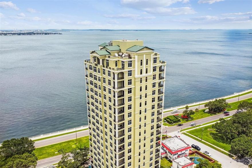 One or more photo(s) has been virtually staged. Stunning views from every room of this Bayshore waterfront Penthouse condo in stately Stovall, with building length balconies on the North and South sides, great for entertaining or just relaxing the day away. This 4 bedroom including Double Master Suites and 2 en-suites, with 4 1/2 total bathrooms occupies the entire 21st floor with over 5,000sf under air, and features formal living and dining rooms with access to the North balcony. The spacious kitchen has 42" wood cabinets and granite tops, with plenty of counter space and center island with prep sink and ice machine, as well as butlers pantry with dual wine chillers. Subzero fridge, wall oven and dual dishwashers, make this the ideal kitchen. Through double doors you enter the true Master Suite with additional double doors splitting the bedroom and bathroom; the large Master Bedroom feature fireplace with framed tv mounted above, walk in closets, and a HUGE bay window that you can actually see the bay, as well as 2 separate doors for access to the South balcony. The Master Bathroom features dual vanities, as well as over sized shower and jetted tub. The second Master Suite has plenty of room for 2 queen beds, and features a large walk in closet, sliding doors out to the balcony, and separate private library. As you enter through double doors, the 3rd bedroom is a full blown en-suite with PHENOMENAL water and Bayshore views through floor to ceiling windows and could easily be considered a 3rd Master Suite, which is currently being utilized as an entertainment tv room. The 4th bedroom en-suite also has gorgeous views, and opens to double doors of the South balcony. The Family room also features floor to ceiling windows, as well as the 1st of 2 wet bars with all hardwood sitting area; simply perfection! The Stovall offers guest parking, concierge service, conference room, fitness room, library, game room with full kitchen, stunning pool overlooking Bayshore and Tampa Bay, plus incredible guest suites for your out of town friends and family! Residence comes with two parking spaces and abundant guest parking in the security monitored parking garage.