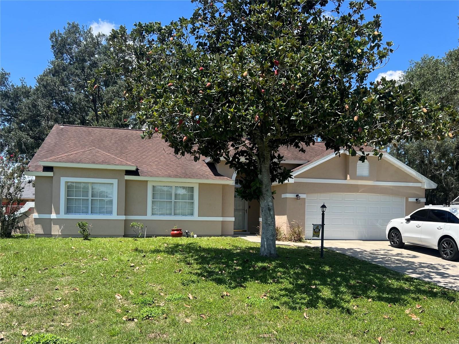 Come take a look at this awesome 3-bedroom, 2-bathroom, 1773 sq. ft. residence designed to offer the perfect combination of style, comfort, and functionality. As you step inside, you'll be greeted by an open great room, seamlessly connecting to the eat-in kitchen that leads to a separate dining area that could also be used as a den or game room; either would be ideal for creating cherished family memories. The large primary suite serves as a private retreat, complete with an ensuite bathroom showcasing a double-sink vanity, soaking tub, stand-alone shower, and a walk-in closet. Two additional generously sized bedrooms provide versatile options for your kids or as guest accommodations or perhaps a home office. A shared full bathroom with a tub/shower combination sits across from the two guest rooms. Step through the sliding glass doors to discover your screened-in covered patio, a perfect spot to unwind and enjoy the outdoors. The large .35 acre lot has a fenced backyard that offers ample space and a safe haven for children and pets to roam freely year-round. Tucked away from the hustle and bustle, SILVER SPRINGS SHORES UNIT 27 (AKA CRYSTAL LAKES) offers an environment of family living while maintaining close proximity to shopping, dining, and the natural beauty of nearby county and state parks. This extraordinary home is ready to welcome you—don’t miss the opportunity to make it yours today!