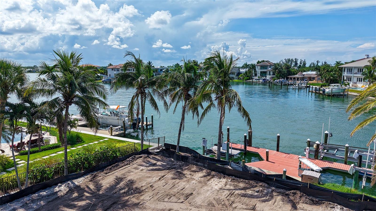 Superb waterfront site to create your own personal tropical Shangri-la. Situated on a sheltered basin, boating enthusiasts will appreciate the
composite dock in place with three lifts (one 30,000 pounds) from which to venture out by boat, kayak, jet ski, or paddle board to bay and gulf waters (minutes away) with no fixed bridges. Conveniently located on the North end of Siesta, boasting tranquil water views and mature landscaping, this is the ideal spot from which to take advantage of all that Siesta/Sarasota offer. Set out by land or sea to enjoy world renowned sugar sand beaches, downtown cultural venues, multiple restaurants, and shopping. Airport and hospital are close at hand.
An opportunity not to be missed!