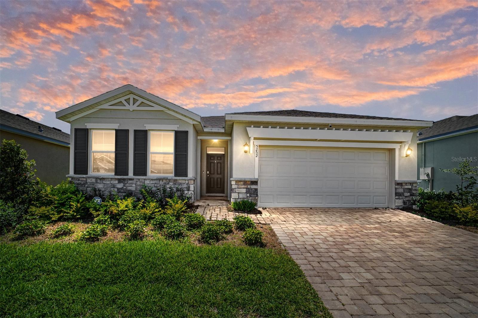 WINTER CIRCUIT RENTAL AVAILABLE! Immerse yourself in luxury living at this stunning 4-bedroom, 2-bathroom Delray model within the prestigious, gated Ocala Preserve community. Just 6 minutes from the World Equestrian Center, this immaculate 2023-built home is perfect for families, offering a fully furnished haven in the non-age-restricted section. Move right in and enjoy a chef's kitchen boasting ample counter space, an eat-in kitchen with barstools, new stainless steel appliances, and a separate dining room area. The light and bright open floor plan creates a welcoming atmosphere. Relax in the luxurious master bedroom featuring a king-size bed, an en-suite bathroom featuring an upgraded glass enclosed shower, granite counter tops, large vanity with dual sinks and a spacious walk-in closet. A second bathroom and guest rooms are situated on the opposite side of the house for added privacy creating a perfect guest wing. Two additional bedrooms with plush queen beds and large closets, plus a fourth bedroom featuring two full-size beds, provide ample space for family or guests! A large, enclosed patio with comfortable seating beckons you to relax and enjoy the beautiful backyard views, complete with the tranquility of no rear neighbors. Tasteful decor, high-end furniture, and upgraded finishes create an elegant ambiance throughout the home. A premium lot with upgraded landscaping further enhances the outdoor experience. The deep 2-car garage offers ample storage and is even golf cart ready! High-speed internet, utilities, and all community amenities are included in the rental rate. Enjoy access to golf, resort-style pools, tennis courts, dog park, 21 miles of serene walking trails, pickleball courts, a day spa, a fitness center, and more! Schedule your private tour today and discover your perfect family getaway at Ocala Preserve!