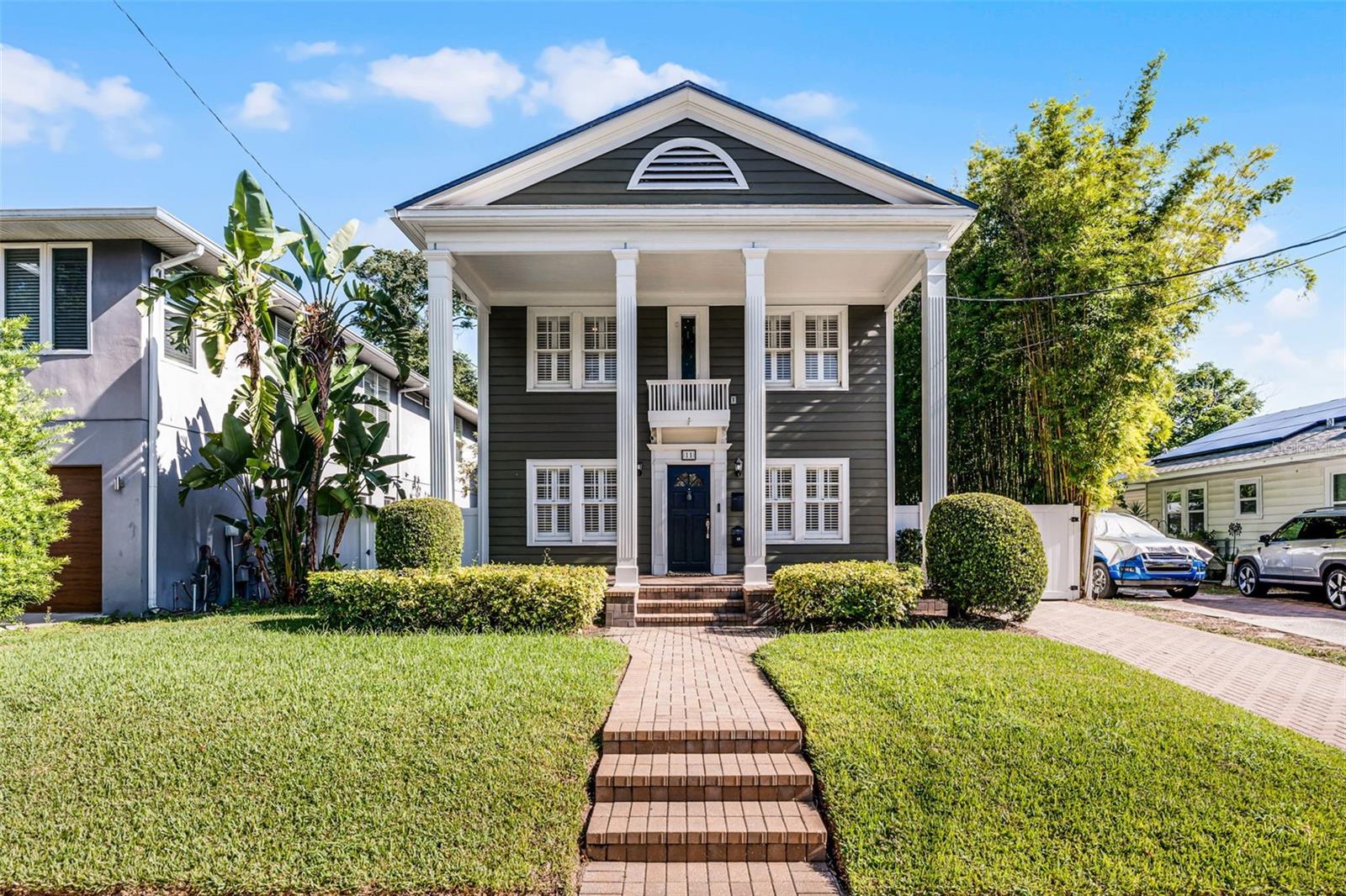 In the heart of College Park, this beautifully updated Colonial-style home offers timeless architecture, modern renovations, and something truly rare; a detached, air conditioned 2-car garage with a 1 bedroom, 1 bath apartment approved for short-term rental. Whether for guests, extended family, or extra income, it’s a feature that sets this property apart. Step onto the inviting front porch and feel the charm of this beautifully updated Colonial-style home in the heart of College Park. Timeless architecture meets modern living here, where refinished hardwood floors, original door hardware, plantation shutters, and elegant modern light fixtures create an atmosphere that feels both warm and refined.The separate living room invites quiet conversation, while the formal dining room is ready for memorable dinners with friends. In the heart of the home, the renovated kitchen with its generous island for casual seating, striking tile backsplash, and custom cabinetry with a built-in pantry and slide-out shelves offers a space as beautiful as it is functional. A nearby laundry room keeps everyday life easy, and a half bath with a pedestal sink is perfectly placed for guests. Upstairs, the wood staircase leads to all three bedrooms. The spacious primary suite feels like a retreat, with two walk-in closets featuring custom organization and a luxurious en-suite bath with a double quartz vanity, soaking tub, and glass-enclosed shower. Two additional bedrooms share an equally stylish bath with quartz counters and a modern shower. The finished basement, with its built-in desk, is ready for your vision, whether it’s a home office, creative studio, or intimate wine cellar. The private apartment above the garage features a bright open living area connected to a kitchen with island seating, a bedroom, full bath with glass-enclosed shower, stackable washer and dryer, and a balcony for enjoying fresh air. A long paver driveway leads to a gated entry and a fully fenced yard. Lush bamboo creates a private oasis around the brick-paver patio, ideal for quiet mornings or lively gatherings under the stars. With new A/C units (2022 & 2023), new roofs (2023), hybrid water heater (2023), full re-plumbing (2023), and a whole-home water softener, the updates are already done. All that’s left is for you to enjoy the vibrant lifestyle of College Park, where shops, dining, parks, and community spirit are just steps away.