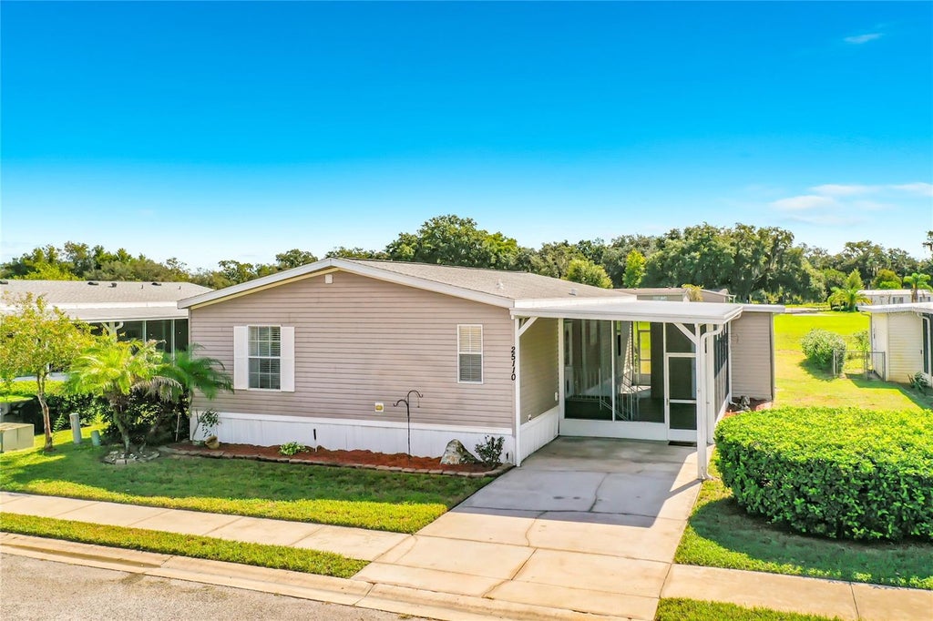 Photo of 25110 Alamanda Dr, Astatula, FL 34705 (MLS # O6438361)