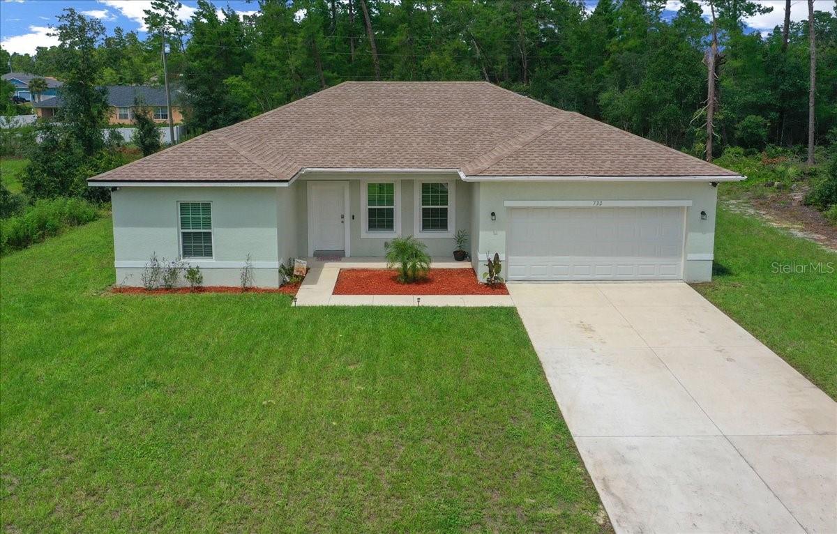 No HOA and No CDD - Welcome to this beautiful 4-bedroom, 2-bathroom single-family home perfectly situated on a spacious .54 Acre Lot, offering plenty of room to enjoy both indoors and out. Step inside to find tile flooring throughout the entire home, including all bedrooms, making maintenance a breeze and adding a modern, cohesive touch. The high ceilings enhance the open and airy feel of the living areas, creating an inviting atmosphere for family and guests.
The kitchen is a true highlight, featuring granite countertops, wood cabinets, and all appliances included, making it move-in ready for your culinary needs. Both bathrooms are equally impressive with granite finishes, providing a touch of elegance and durability. For added convenience, a washer and dryer are also included.
This property offers the best of both worlds: a comfortable interior with thoughtful upgrades, and a large .52-acre lot that provides endless potential for outdoor enjoyment, entertaining, or future customization. With so much to offer, this home is truly a must-see. Don’t miss your opportunity to make it yours!