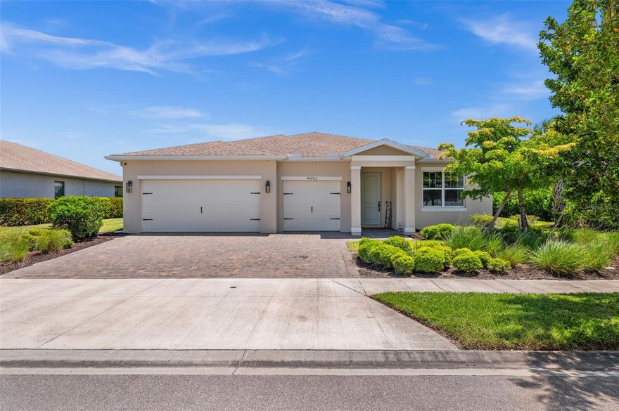 Welcome to 43763 Longleaf Lane in Babcock Ranch, FL!

This is the one everyone's been waiting for. Nestled in Lake Babcock, one of Babcock Ranch's most mature and coveted neighborhoods, this stunning 3-bedroom plus den home delivers the full Florida dream on a premium lake-view lot with a private screened pool, three-car garage, and over 2,100 square feet of thoughtfully upgraded living space. And for qualified veterans, it gets even better: this home is eligible for an assumable VA loan at an extraordinary 2.35% interest rate. In today's market, that is not just a perk, that is a game changer.

Pull up to impeccable curb appeal: a paver driveway, lush tropical landscaping, and clean modern stucco that hints at everything waiting inside. Step through the front door into a bold board-and-batten entryway with dramatic gray paneling that flows into a bright, open-concept layout designed for real life and effortless entertaining. The great room is anchored by oversized tile floors, recessed lighting, and sliding glass doors that frame your pool and lake view like a living painting.

The kitchen will stop you in your tracks. Crisp white shaker cabinets, granite countertops on every surface, a bar-seating island, wall oven and microwave, and a patterned geometric backsplash that adds just the right amount of personality. There's even a dedicated custom built walk-in pantry for the chef who means business.

The flexible den has been converted into a full fourth bedroom with a barn door and wall-mounted closet, while the primary suite serves as a true escape with tray ceilings, pool and lake views, a frameless glass shower, and a custom walk-in closet built out to the nines with shelving, shoe racks, and center drawers.

Then there's the backyard. A covered lanai with ceiling fan and dining set leads to a gorgeous paver pool deck surrounding a sparkling rectangular pool, all enclosed in a screened cage with picture frame screen for unobstructed lake and palm tree views beyond the black aluminum fence. No rear neighbors. Just open sky and Florida vibes.

Babcock Ranch is America's first solar-powered town with trails, top-rated schools, restaurants, and a town center, and Lake Babcock's established streets offer the settled, tree-lined character that newer phases simply cannot match.

This home checks every box and then adds a few more. And if you've served this country, it may just be the most financially powerful move you make all year.