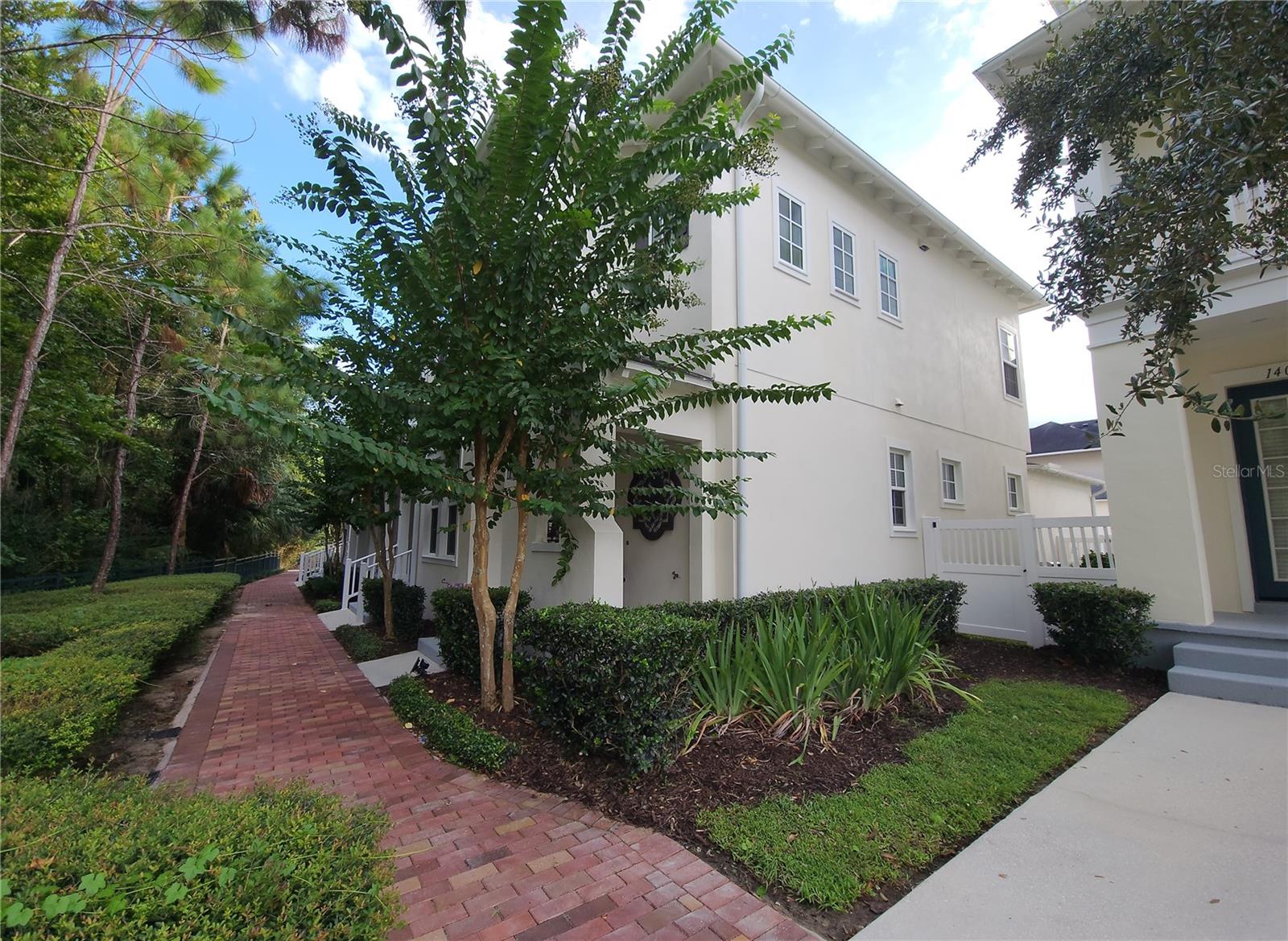HOME SWEET HOME IN CELEBRATION! This beautiful, SPACIOUS 3-BEDROOM, 2-BATHROOM CORNER townhome is nestled in the picturesque Celebration Community offering RESORT-STYLE AMENITIES--pool, fitness center, playground, park, scenic lake views and ample walking trails! Stroll around the lake in the most charming downtown Celebration! The home is designed with relaxation and privacy in mind as you enjoy quiet, peaceful moments in your own covered front porch facing the nature walking trail. This desirable corner unit features a spacious, open floor plan with plenty of natural light and a GORGEOUS KITCHEN with an oversized island perfect for entertainment! The three bedrooms and two bathrooms are on the 2nd floor with the washer and dryer on the same floor for convenience! And the FLEX ROOM can be used as a home office, den, library or play room is on the main level with direct access to the half bathroom also on the main floor. Special Features of the home are French Doors, granite countertops, wood rail stairs, triple paned windows, large 2-Car Garage and so much more! The fenced-in side yard offers a dedicated space for pets to play and for enjoying outdoor grilling. MUST SEE! Schedule your tour today!