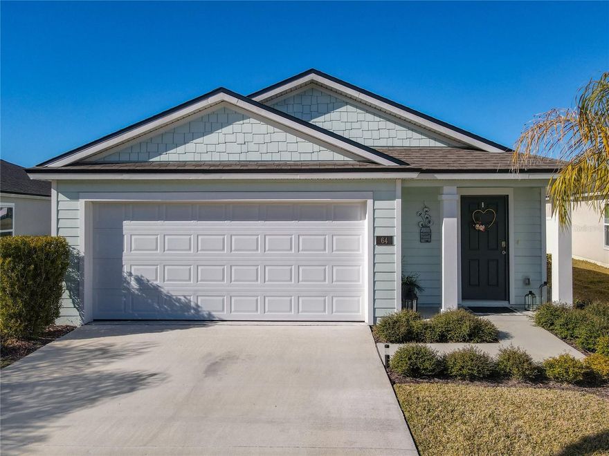 This nearly NEW 3-bedroom, 2-bath home offers 1,222 sq. ft. of well-designed living space with PANORAMIC POND and GOLF COURSE VIEWS. Located in The Links, a gated community within Grand Reserve, this resort-style neighborhood is built around the Grand Reserve Golf Course and offers a peaceful yet active lifestyle. The home blends modern finishes with comfortable living and features an open kitchen with Quartz countertops, white cabinetry, stainless steel appliances, and a walk-in pantry. The Primary Suite includes a walk-in closet, walk-in shower, and linen closet, while the additional bedrooms are nice in size, offering flexibility for guests or a home office. Enjoy aa extra large backyard with scenic water and golf course views, providing plenty of space to relax or entertain. Additional features include a tankless water heater, natural gas connection, smart home system, and irrigation. Community amenities include a resort-style pool, clubhouse, pickleball courts, walking trails, and gated entry. Conveniently located just 8 miles from Flagler Beach and close to Palm Coast shopping, dining, schools, and healthcare. The home can be sold furnished and that would be negotiated separately. All information intended to be accurate but cannot be guaranteed.