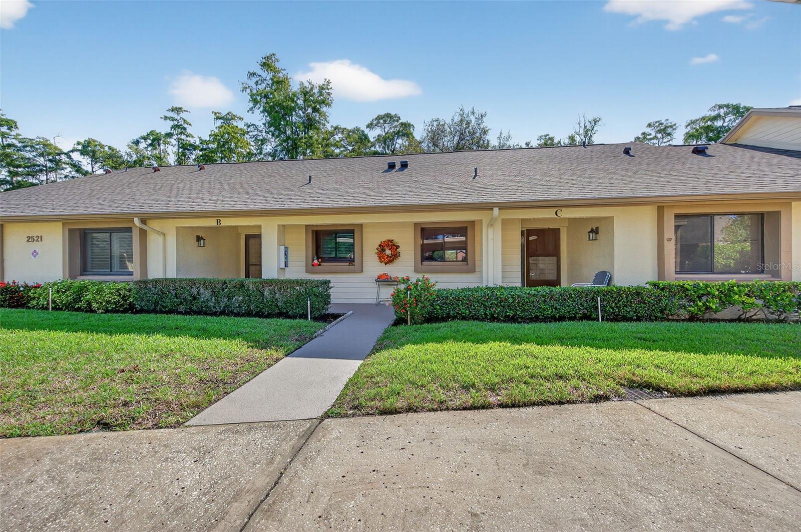 Welcome home to the highly desired community of Village on the Green. Purchase with peace of mind! This property has an elevation of over 70'. It is in Flood Zone X and a Non Evacuation Zone. The reserves are fully funded! As a single-story building, it is exempt from Milestone Inspections, impacting condos three stories and higher. Dive into paradise with this two-bedroom, two-bath villa, perfectly nestled on the community lake in a vibrant 55+ community! You are going to love the serene lake view from your Florida room. The living area is large and includes a dining area adjacent to the living room. From the living room you have a large, secluded Florida room, perfect for your morning coffee, afternoon reading and evening refreshments. The primary suite is large with a walk in closet and en-suite bathroom with a walk in shower. The guest bedroom can also be used as an office or den. The villa has it's own laundry room inside the unit with shelves and room for storage. The perks don't stop there! This community is a lifestyle, not just a location. Enjoy a sparkling pool, a clubhouse with a fitness center, library, card room and banquet room. Outside you will find the shuffleboard courts and community picnic area complete with gas grills for residence use. The clubhouse offers card playing and board game groups of all kinds as well as a shuffleboard group that meets weekly in the fall through the spring. Additionally there are regular community events throughout the year. Your condo fees include, water, sewer, trash, cable tv and internet in addition to all of the exterior maintenance and common area maintenance. And the best part, you're just minutes away from the heart of vibrant Downtown Dunedin, with its charming shops, delectable dining, and lively entertainment. Plus, you’re close to Honeymoon Island, Caladesi Island and more of Florida’s best beaches and fun activities. This villa offers you peace of mind and fun in the sunshine. Don’t just dream of the Florida lifestyle – live it!