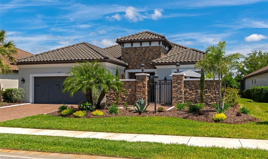 A true standout within Azario at Lakewood Ranch, this Pallazio model delivers a refined take on Florida luxury living — combining high-end finishes, smart design, and a setting that’s hard to replicate.

From the moment you arrive, the private courtyard entry sets the tone. A tranquil water feature and custom double glass front doors create a clean, striking first impression while bringing in natural light right from the start. Inside, the home carries a crisp, modern feel with thoughtfully selected upgrades throughout. The kitchen is exactly what buyers are looking for — quartz countertops, upgraded cabinetry, stainless steel appliances — all opening seamlessly into the main living space for a layout that just works.

Out back is where this property separates itself. The recently completed pool sits against a private preserve backdrop, giving you a level of privacy that’s getting harder to find. The covered lanai is oversized and dialed in with a full summer kitchen, making it just as suited for hosting as it is for a quiet night at home.

The primary suite is positioned as a true retreat with a large walk-in closet and a well-appointed bath featuring dual vanities and a walk-in shower. Guest bedrooms are thoughtfully laid out, including one with its own en suite, and the den gives you flexibility for an office, media room, or overflow space depending on how you live.

Azario continues to be one of the most sought-after communities in Lakewood Ranch for a reason — offering a full amenity package including resort-style pool, fitness center, tennis, pickleball, on-site dining, and championship golf, all within a gated setting.

Fully finished, move-in ready, and dialed in where it counts; this is the kind of property buyers are hoping to find but rarely do.

A full 3D virtual tour is available, giving buyers the ability to walk the home, understand the layout, and experience the flow before ever stepping inside.