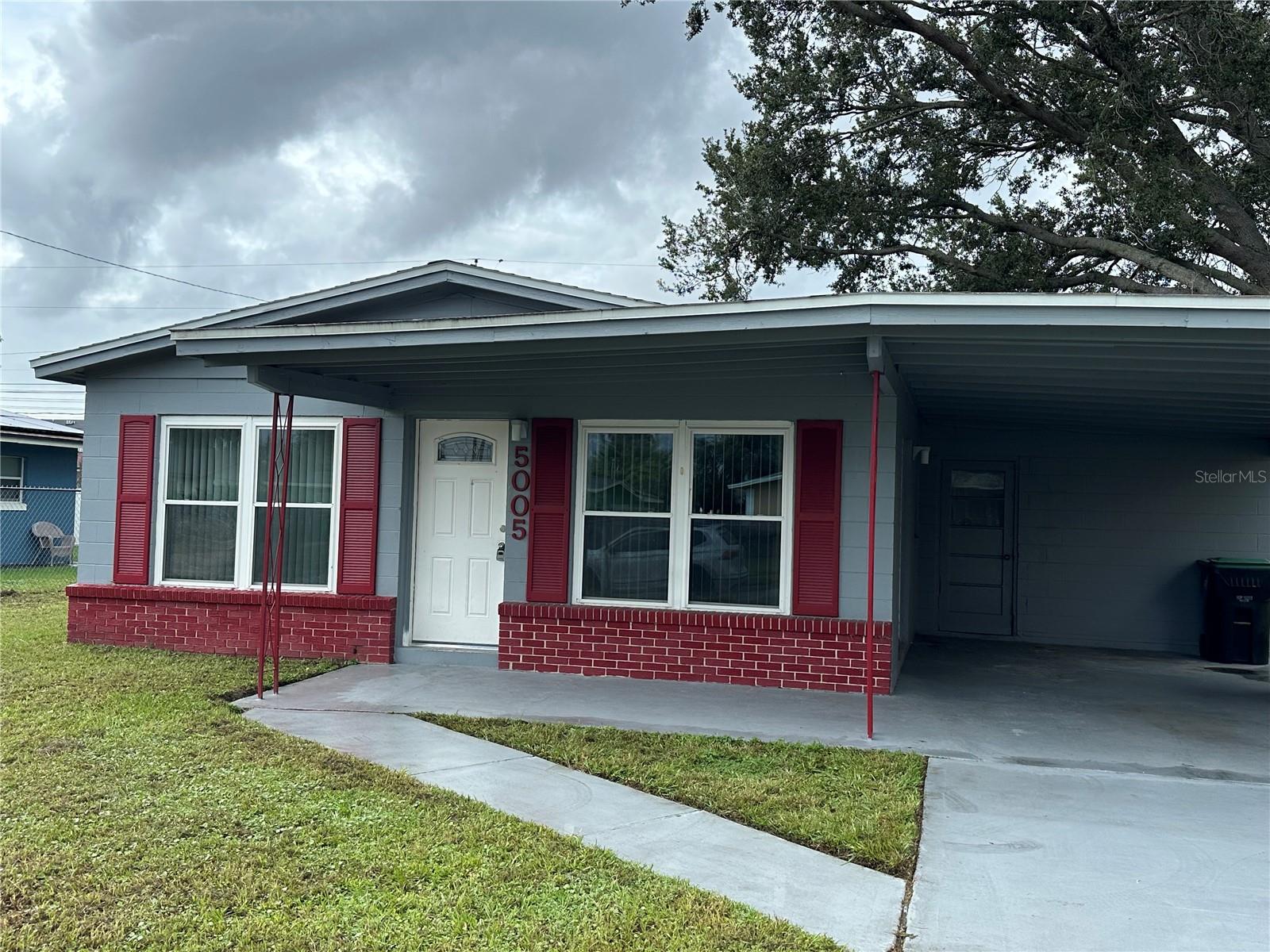 This 3-bedroom 2-bathroom home is available for IMMEDIATE OCCUPANY in Tangelo Park! This home features tile in all rooms including the bedrooms! The kitchen is spacious with ample cabinet space and pantry. The dinette area is an extra bonus of this adorable home and has a ceiling fan. All 3 bedrooms are equipped with ceiling fans as well and have spacious closets. There is a hallway closet which is great for extra storage! The master bathroom and hallway bathroom have been updated. Enjoy the front porch, side patio and back patio on cool days while entertaining guests. The backyard is partially fenced in along with the front. This home features a carport and private mailbox. There are washer and dryer hook-ups are located outside in a storage closet on the backside of the carport. Income requirement is a combined income of 3 times the monthly rent. Pets are welcome with a $300 refundable pet deposit and a $300 non-refundable pet fee. No aggressive breeds are allowed of any kind. Lawn care is NOT included in the monthly rent. Close to the bus line. Strong rental history is a MUST! No current or past evictions, no exceptions. Contact us today as this home will not be on the market for too long!