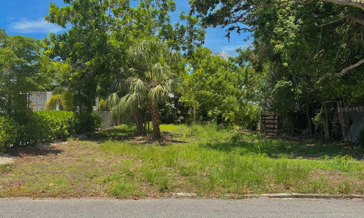 718 Hudson Avenue is a rare, buildable 7,032 sq ft vacant lot in the heart of downtown Sarasota, within the charming and historic Burns Square and Laurel Park neighborhoods. This lot is in a chic; modern enclave of newly constructed residences nestled within the historic Laurel Park neighborhood. This community showcases clean lines, flat roofs, expansive windows, and a contemporary architectural palette—offering a refreshing contrast to the Mediterranean Revival and bungalow styles that defined the area during the 1920s. These homes are seamlessly integrated into one of Sarasota’s most storied districts, providing residents with both design-forward elegance and an enviable downtown address. Situated just three blocks from Bayfront Park, this property offers residents easy access to a premier 3.5-acre waterfront green space featuring a splash pad and playground, dog friendly zones, kayaking and canoe launches, picnic areas, fitness trails, and sweeping views of Sarasota Bay and the Ringling Causeway Bridge.
Living in this enclave means enjoying a walkable cultural lifestyle: stroll to nearby Burns Court to discover independent cinemas, artful cafés, local galleries, and eclectic boutiques. Each November, the renowned Sarasota Chalk Festival fills the streets with stunning sidewalk murals and public art, transforming the district into an open-air gallery. Downtown Sarasota also pulses with arts and culture year-round—from the John and Mable Ringling Museum and Marie Selby Botanical Gardens to the Florida Studio Theatre, Van Wezel Performing Arts Hall, the Sarasota Ballet, Opera, and Circus Arts.
Beyond the arts, Sarasota’s urban core features a lively mix of dining, shopping, and recreation. Residents can linger over craft cocktails and rooftop sunsets, sample fresh Gulf catch at waterfront restaurants, or enjoy farmers markets, boutique stores, and eclectic nightlife. The Legacy Trail and city greenways provide scenic bike and walking routes, while the nearby barrier islands—Siesta, Lido, South Lido—are world famous for bright quartz beaches and marine adventures.
718 Hudson Avenue presents a unique opportunity to develop a custom residence that takes full advantage of urban conveniences: cultural richness, coastal recreation, and a close-knit historic neighborhood just minutes from the sparkle of Sarasota Bay.
The lot is currently zoned RMF-3. Forward looking buyers might also explore future land use designations such as DTE or DTNE. All zoning requirements need to be independently verified with the City of Sarasota.
