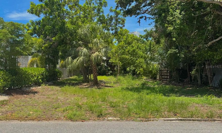 718 Hudson Avenue is a rare, buildable 7,032 sq ft vacant lot in the heart of downtown Sarasota, within the charming and historic Burns Square and Laurel Park neighborhoods. This lot is in a chic; modern enclave of newly constructed residences nestled within the historic Laurel Park neighborhood. This community showcases clean lines, flat roofs, expansive windows, and a contemporary architectural palette—offering a refreshing contrast to the Mediterranean Revival and bungalow styles that defined the area during the 1920s. These homes are seamlessly integrated into one of Sarasota’s most storied districts, providing residents with both design-forward elegance and an enviable downtown address. Situated just three blocks from Bayfront Park, this property offers residents easy access to a premier 3.5-acre waterfront green space featuring a splash pad and playground, dog friendly zones, kayaking and canoe launches, picnic areas, fitness trails, and sweeping views of Sarasota Bay and the Ringling Causeway Bridge.

Living in this enclave means enjoying a walkable cultural lifestyle: stroll to nearby Burns Court to discover independent cinemas, artful cafés, local galleries, and eclectic boutiques. Each November, the renowned Sarasota Chalk Festival fills the streets with stunning sidewalk murals and public art, transforming the district into an open-air gallery. Downtown Sarasota also pulses with arts and culture year-round—from the John and Mable Ringling Museum and Marie Selby Botanical Gardens to the Florida Studio Theatre, Van Wezel Performing Arts Hall, the Sarasota Ballet, Opera, and Circus Arts.

Beyond the arts, Sarasota’s urban core features a lively mix of dining, shopping, and recreation. Residents can linger over craft cocktails and rooftop sunsets, sample fresh Gulf catch at waterfront restaurants, or enjoy farmers markets, boutique stores, and eclectic nightlife. The Legacy Trail and city greenways provide scenic bike and walking routes, while the nearby barrier islands—Siesta, Lido, South Lido—are world famous for bright quartz beaches and marine adventures.

718 Hudson Avenue presents a unique opportunity to develop a custom residence that takes full advantage of urban conveniences: cultural richness, coastal recreation, and a close-knit historic neighborhood just minutes from the sparkle of Sarasota Bay.

The lot is currently zoned RMF-3. Forward looking buyers might also explore future land use designations such as DTE or DTNE. All zoning requirements need to be independently verified with the City of Sarasota.