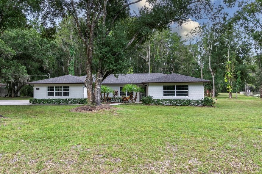 Welcome to 3490 Old Keystone Road, located in a highly desired area of Tarpon Springs, Florida. This magnificent property offers a perfect blend of luxury, comfort & serene county living.  Nestled on a gorgeous 2.37-acre equestrian-friendly parcel with the renowned Brooker Creek Preserve horse trails just across the street. This unique property offers an unapparelled connection to Florida's natural beauty where majestic deer, sandhill cranes & wild turkey are frequent visitors.  Step inside and prepare to fall in love.  Beautifully updated throughout, this 4-Bedroom, 2.5-Bathroom showstopper spans 2,454 sq ft, all on one floor with ample living and dining spaces, including a welcoming living room, formal dining space, a cozy breakfast nook and a separate family room for relaxation & gatherings.  Another attractive feature is the large bonus room, which has its own entrance, making it an ideal space for an in-law suite or home office.  The interior showcases wood look, tile flooring throughout the main living areas of the home with luxury vinyl in the bedrooms.  The kitchen is a dream- newly updated with granite countertops, crisp white cabinetry, farmhouse-style sink with goose neck faucet, large closet pantry and a French door refrigerator. The master suite is spacious with a great view of the backyard and so private you could leave the blinds open all the time.  The master has a large walk-in closet, ensuite bathroom with walk-in shower & sliding doors that overlook the tranquil pool.  This home has generous sized rooms with so much versatility, plus a split bedroom plan for privacy.  There's lots of closet space throughout the home and an inside laundry room.   As you step outside, you'll be welcomed to your own private oasis: an expansive screened-in lanai with a sparkling swimming pool, perfect for you to cool off on warm afternoons & simply relax and unwind.  Don't forget to take a stroll down the shaded, tree lined road to the back of the property where you'll find a peaceful pond & big red barn. The 40'x40' concrete block barn makes a fantastic workshop, with water & electric and lots of space to accommodate any hobby.  Bring the RV, boat, pets and all the toys, there's no deed restrictions or HOA here.  The home has county water and a private well to use for animals & irrigation. Roof is 5 years, New sliding door in Master & New windows in 2018. Pool has been resurfaced including patio pavers & screen lanai.  Property is in Flood zone X, no flood insurance required.  Located in a top-rated school zone.  This truly is a natures paradise, offering a rare blend of rural living with all the convenience.  SELLER FINANCING AVAILABLE, call for more details.   This one isn't going to last long, give me a call today to schedule your private showing.