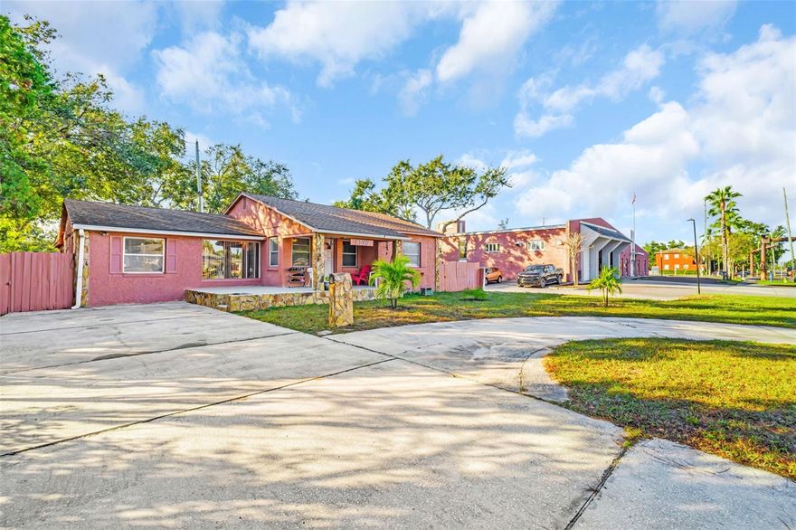 Welcome to this charming 3-bedroom, 2-bath single-family home located in the desirable Lake Pasadena neighborhood of St. Petersburg. Offering 1,448 square feet of thoughtfully designed living space, this residence blends timeless character with everyday functionality. Inside, you’ll find a welcoming split floorplan highlighted by classic arched doorways, beautiful original hardwood floors, and ceramic tile. The spacious living room features warm wood-paneled walls, while the dedicated dining room showcases an eye-catching brick accent wall—perfect for hosting memorable meals. A separate family room provides additional flexibility for entertaining, relaxing, or working from home.
Situated on a generous 1/5-acre lot, the outdoor space is equally impressive. Enjoy a large front porch, an extra-large rear patio ideal for family gatherings and barbecues, and a sizable yard with alley access. The circular driveway adds convenience and curb appeal, while the oversized laundry and storage room offers ample space rarely found at this price point. Major updates include an HVAC system just two years old. For added peace of mind, this home is not located in a flood or evacuation zone. Ideally positioned close to the beaches, Gulfport, and vibrant downtown St. Petersburg, this Lake Pasadena gem offers the perfect combination of charm, space, and location. Call to schedule your private showing today!