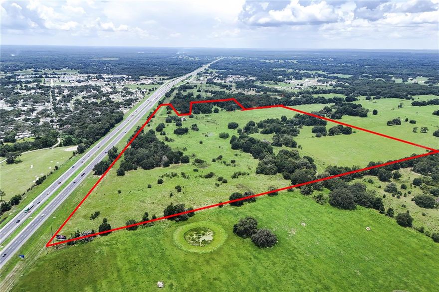 Large Scale Industrial Development Opportunity - This 95.45-acre industrial site is strategically located north of County Road 48 and directly west of Interstate 75 in Bushnell, Florida. The property offers exceptional accessibility and visibility, featuring approximately 2,900 feet of frontage along I-75, one of Central Florida’s primary north-south transportation corridors. Its prominent exposure makes it well-suited for a range of industrial or logistics-oriented uses. A cell tower is currently situated on the property; however, the land lease rights have been previously purchased by the tower owner and do not convey with the sale. Municipal water is available nearby, and sewer service is anticipated to be available in the near future, supporting future development potential. With its location, scale, and infrastructure access, this parcel presents a strong opportunity for industrial users or developers seeking a well-positioned site within the expanding I-75 corridor.