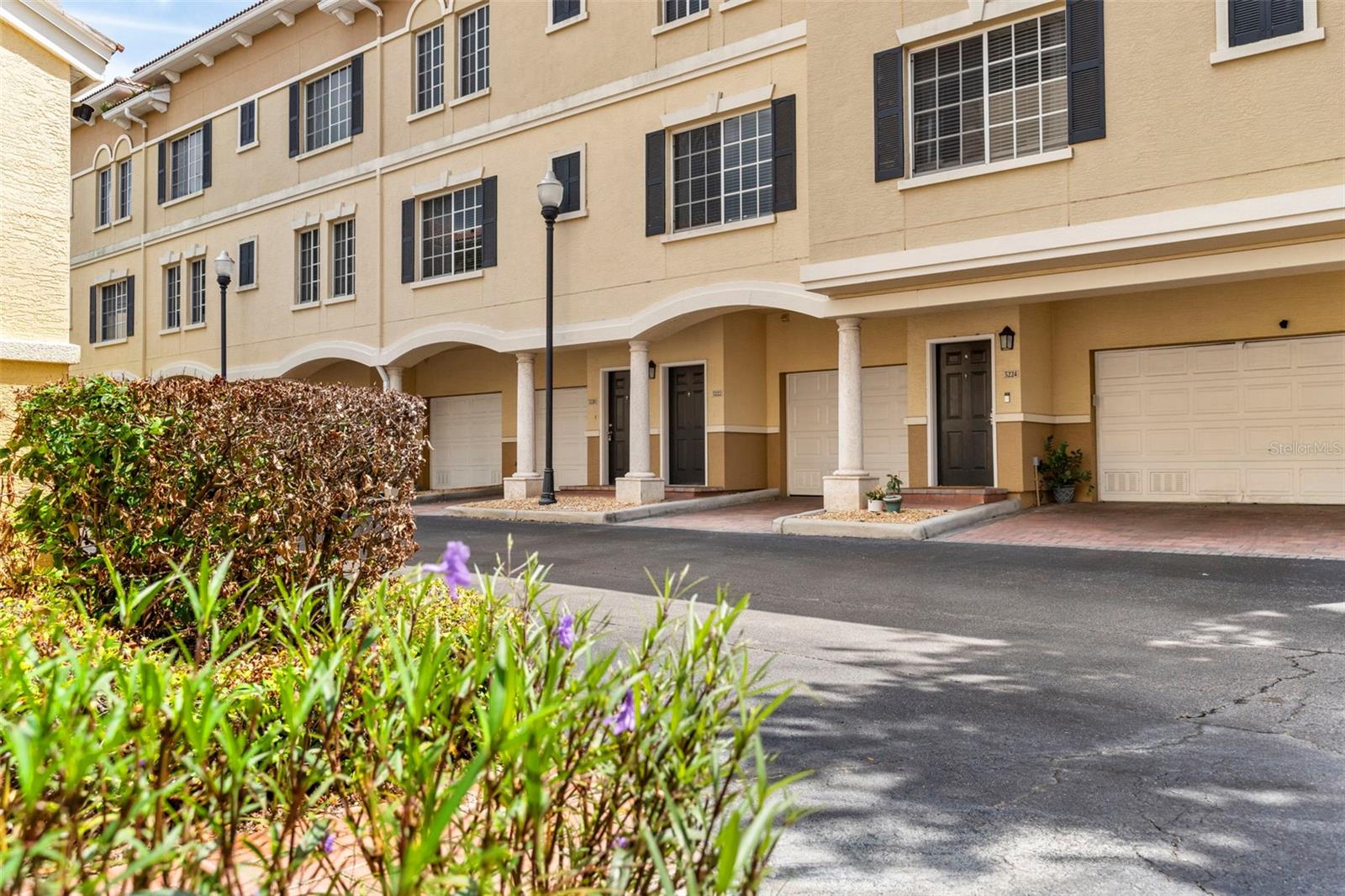 One or more photo(s) has been virtually staged. Find a great blend of modern living and convenience in this nicely updated South Tampa townhome with an attached garage. Your new home is ideally situated just minutes from boating, golf, tennis, pickleball, the stunning Gulf Coast beaches of St. Pete and Clearwater Beaches, Tampa International Airport, and St. Pete Clearwater International Airport. It's also located minutes from top rated and casual dining, shopping, sporting events, and cultural attractions near Downtown Tampa, Hyde Park Village, and Downtown St. Petersburg. Inside, the kitchen offers premium Whirlpool stainless steel appliances, complemented by luxury plank flooring and tile that runs throughout the home. The beautiful Pottery Barn window treatments add a luxury finish, while new sconces, chandeliers, and ceiling fans enhance the atmosphere with both style and functionality. Modern LED lights and updated switches provide a new home feel, with new screens and blinds for both privacy and convenience. The first master suite has modern luxury updates, featuring a beautiful high-end quartz countertop vanity, and upscale faucets. The second master bathroom has also been updated with a new vanity, lights, fixtures and toilet. Additional upgrades include a new garage door opener, providing added security and ease of access. Enjoy the convenience of walk-in closets and an on-site washer and dryer, making everyday living easier. Located within A-rated school districts of South Tampa, approximately a 5 minute walk to Publix, and steps to other adjacent neighborhoods, this home also offers exceptional community amenities. Take advantage of the gorgeous resort-style pool, a newly remodeled clubhouse and club/game room with kitchen, and a well-equipped gym with weights and cardio machines; all just steps from your door, in this quiet, pet-friendly community. Schedule your private tour today, and learn about how you can purchase with special financing programs, or park some of your cash in real estate, so you can own, or invest, while living in your new South Tampa home today!