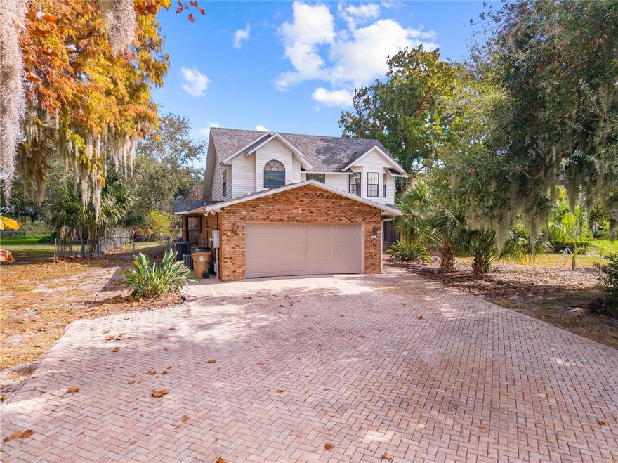 Lakefront property on E. Lake Toho! No HOA, YAY!! This Four bedroom Two and a Half bath two story home pool home has a remodeled kitchen, updated 18 x 18 porcelain tile flooring downstairs, a remodeled master bath, replaced roof and skylights in 2018, replumbed in 2020, downstairs a/c replaced 2023, all exterior doors replaced with fiberglass doors and the interior was freshly painted in 2023. The kitchen features Cherry wood cabinets, granite counters, stainless steel appliances, tiled backsplash, recessed lighting, eating space, and a closet pantry. The large laundry room measures 6 x 10’5 and features a laundry tub, cabinets and a large pantry for extra storage and there is another utility closet next to the laundry room. The large great room is perfect for entertaining and features skylights, ceiling fans, French doors to the pool deck on 2 sides. There is also a half bath downstairs, a linen closet and the primary suite which features a remodeled bathroom with a soaker tub, dual sinks, a HUGE walk-in shower and access to the pool, the bedroom features a ceiling fan and 2 extra wardrobes plus a walk-in closet. The other 3 bedrooms are upstairs, and all have engineered hardwood flooring and ceiling fans, there is a small loft at the top of the stairs and 1 full bath with a newer gentleman’s height vanity with dual sinks. The 3rd bedroom has access to a large deck overlooking the pool and lake. The 3 Bay windows are in the primary bedroom, the 2nd bedroom and the kitchen. Other great features include storage under the stairs, a foyer, coat and vacuum closet, front screened porch, fully fenced south side of the property, which is great for pets or children, screen enclosed inground sports pool, with seating and spa with child safety fence, a large driveway finished with pavers, a storage shed and lean-to for extra storage of yard equipment. The garage features, attic stairs, shelving, a side entry pedestrian door, new door opener and ceiling fan. Come see it today!!