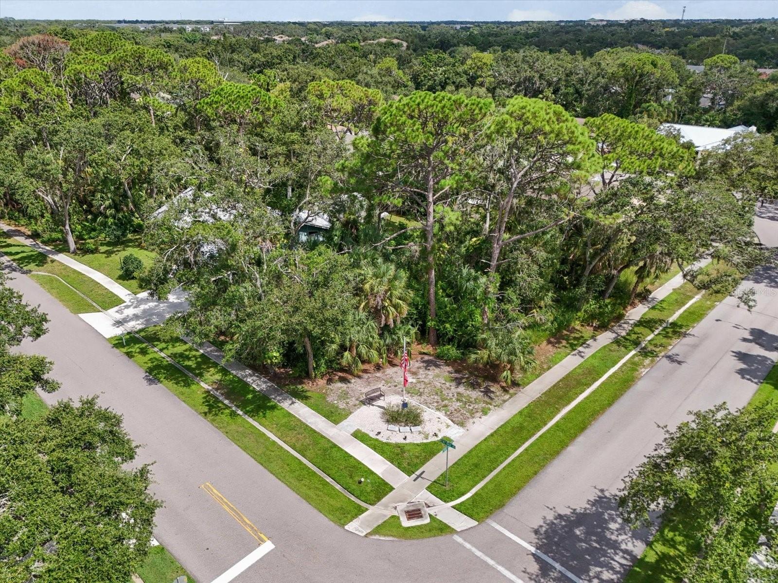 Build your dream home on this rare vacant corner lot shaded by majestic mature oak trees in a peaceful Sarasota neighborhood. This spacious corner lot offers plenty of room to create your perfect outdoor living space with privacy and natural beauty. Previous owner just wanted to be able to see natural beauty from his lot across the street. While separated by a road, buyers could purchase both lots together, ideal for those wanting additional space or investment opportunities. Conveniently close to shopping, dining, I-75, and the Gulf Coast beaches, this is a prime location to build your Florida lifestyle!