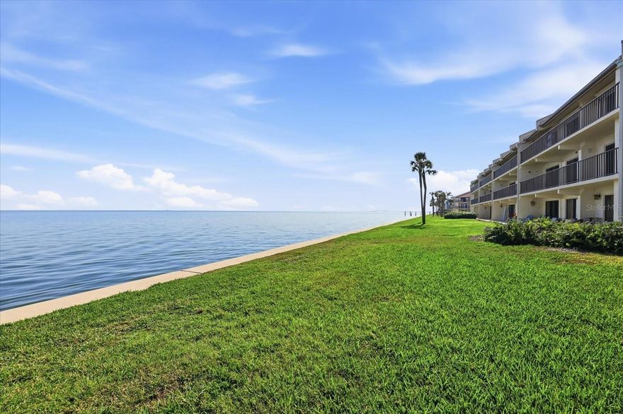 One or more photo(s) has been virtually staged. Discover the ultimate waterfront lifestyle at Seapointe Terrace with this beautifully remodeled, ground-floor condo offering wide-open views of Tampa Bay and the iconic Skyway Bridge. Enjoy daily dolphin sightings, watch boats drift by, or cast a line off the community fishing dock (soon to be newly redone). Just steps from your door, relax in the heated pool, unwind in the clubhouse, or stay active on the tennis courts—the perfect blend of serenity and recreation.
Inside, this 1,405 sq ft residence has been thoughtfully updated throughout and features 2 spacious bedrooms with full ensuite bathrooms, an office, indoor laundry, and both a front patio and rear waterfront patio for seamless indoor-outdoor living. The redesigned kitchen boasts all-new cabinets, modern appliances, a breakfast bar, and direct access to the front patio—ideal for morning coffee. The open living and dining area flows to the waterfront patio, showcasing uninterrupted views that make every day feel like a getaway.
While the condo has experienced minimal flooding this home has been beautifully refreshed and is move-in ready.
Seapointe Terrace is perfectly located: just 5 minutes to I-275, offering a quick drive to the Tampa Airport, downtown St. Pete, or Sarasota. Enjoy St. Pete’s top-tier restaurants, music venues, vibrant arts scene, galleries, and museums—plus you’re only minutes from the sparkling Gulf beaches, world-class golfing, and endless outdoor activities.
Whether you’re seeking a full-time residence or a waterfront retreat, this condo delivers the lifestyle you’ve been dreaming of. Come experience the views, the convenience, and the coastal charm—this one won’t last!