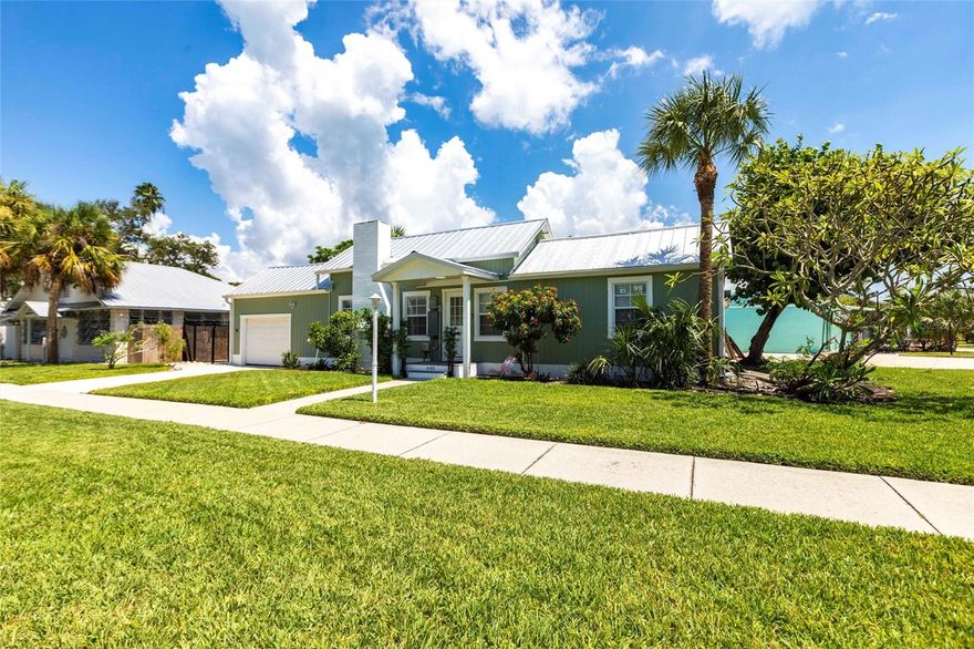 Step into living history in the heart of Historic Longbeach Village. This exceptional property occupies land that was part of Civil War veteran Thomas Mann’s 144-acre homestead, where in 1891 he built the island’s first permanent residence just steps away. This serene corner lot is where Longboat Key truly began! Fully rebuilt and elevated in 2025 to the highest modern standards after the 2024 storms, this turnkey coastal residence offers unmatched peace of mind and contemporary luxury. The light-filled, open-concept interior features vaulted ceilings, a gourmet kitchen with new stainless-steel appliances and quartz countertops, and two beautifully appointed spa bathrooms with premium fixtures and rainfall showers. The primary suite indulges with a king bed, wet bar, mini-fridge, and a windowed en-suite bath, while the second bedroom provides a comfortable queen bed. A dedicated home office is your third bedroom, with its full-size Murphy bed/desk.

The private tropical backyard serves as a tranquil oasis, complete with a serene lily-pad pond, fire pit, and mature landscaping. Delivered fully furnished with beautiful coastal décor and equipped with high-speed fiber internet, the home is ideal for immediate personal enjoyment, remote work, or proven vacation-rental income. Grandfathered Village zoning permits short-term rentals.

Enjoy an unparalleled lifestyle just a short walk from Whitney Beach, historic fishing docks, bay kayak launches, and waterfront dining. Longboat Key Club, St. Armands Circle, and downtown Sarasota’s world-class amenities are only minutes away.

Rarely available: authentic historic significance, a total top-to-bottom 2025 rebuild, and the quintessential Village address. Move-in ready