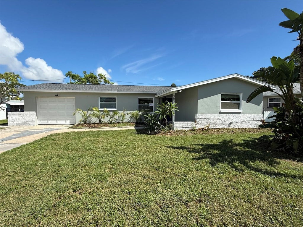 Photo of 307 87th Avenue NE, St Petersburg, FL 33702 (MLS # W7886710)