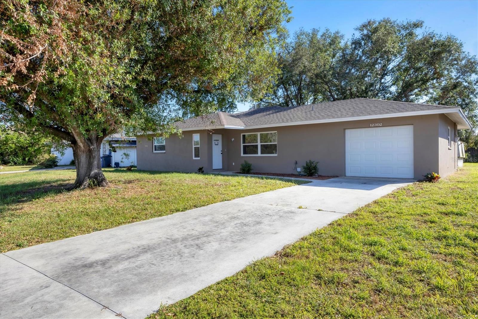Welcome to 12302 Tangier St, a delightful block 3 bedroom, 2-bathroom home nestled in the heart of North Port, FL close to shopping and Warm Mineral Springs. NEW ROOF, NEW SEPTIC, NEW WINDOWS. This beautifully updated property offers a perfect combination of comfort, convenience, and charm.
As you step inside, you’ll immediately appreciate the 1700 sq foot open and spacious floor plan. The inviting living room is filled with natural light, providing a perfect space for relaxation and entertaining guests. The neutral color palette throughout the home creates a warm and welcoming atmosphere.
The kitchen is a chef’s dream with white shaker cabinets, new stainless steel appliances, granite countertops and a convenient layout that makes meal preparation a breeze. Whether you're hosting family dinners or enjoying a quiet morning, this kitchen is sure to meet all your needs.
The master suite features a generously sized bedroom and an en-suite bathroom, offering a private retreat at the end of each day. Roof 2023, NEW Septic and drain field. Not in a flood zone!