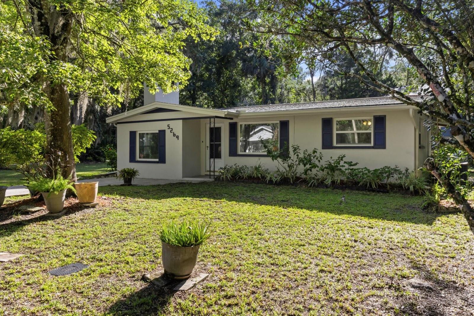 Welcome to this beautifully maintained 3-bedroom, 2-bath home located in the heart of Old Homosassa—just minutes from waterfront access, the river, and the local marina where you can launch your boat or rent one for a day on the water. Despite its close proximity to the river, this home has never flooded, offering peace of mind during Florida’s storm seasons. It also features a Generac whole-house generator for added security during power outages. Upgraded double-pane windows improve efficiency, and the interior and exterior have been freshly painted. Inside, you’ll find laminate flooring throughout, with ceramic tile in the laundry and back bathroom, as well as new ceiling fans, light fixtures, and a brand-new water heater—making the home completely move-in ready. Step into a cozy living room/sitting area, then down into a spacious family room with a wood-burning fireplace. The galley kitchen is open on both ends, connecting the living room and dining area, creating a bright and open feel. A split-bedroom floor plan offers privacy, with two bedrooms and a full bath off the hallway, and a third bedroom located just off the kitchen. There is also a large walk-in pantry/storage room for added convenience. A second full bath is located in the rear of the home near the laundry area. Additional features include central HVAC throughout the main house (with a new window unit for better temperature control in the pantry/laundry area), a carport that could easily be enclosed, and a dining room with Florida Room-style windows that provide views of the backyard. The backyard includes a concrete pad that could be used for a shed, patio, or future outdoor space. A propane tank services the generator and can also be used for optional propane heating, thanks to built-in heaters in the home. This home offers a rare combination of charm, comfort, and resilience. Whether you're looking for a full-time residence, seasonal retreat, or investment opportunity, this property in Old Homosassa is clean, updated, and ready for its next chapter.