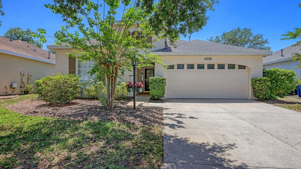 Photo of 12228 Winding Woods Way, Lakewood Ranch, FL 34202 (MLS # A4690320)