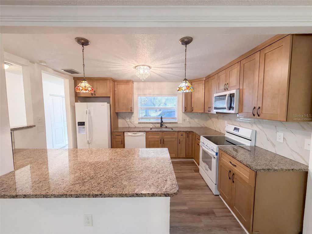 Photo of 5122 Bay Boulevard, Port Richey, FL 34668 (MLS # O6435777)