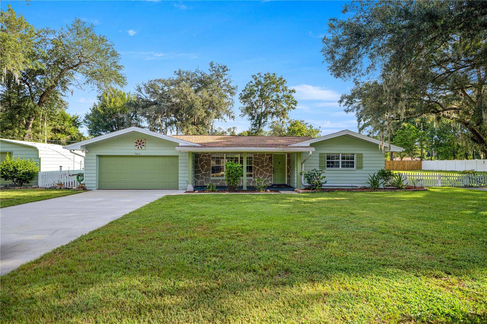 Welcome to this beautifully maintained 3-bedroom, 2-bath home in Crystal River, FL, offering the perfect blend of comfort, functionality, and outdoor charm. Set in a peaceful, park-like setting, the property features its own rock waterfall—a tranquil touch that makes the backyard feels like a quiet retreat. Inside, you'll find a spacious and inviting layout, along with a large 20x32 screened porch for entertaining or simply enjoying the Florida breeze. The fully fenced yard, while a 12x13 utility building provides added storage. Hobbyists will love the 20x22 detached garage with electric, also known as the “man cave,” and there’s an 18x20 carport to accommodate your extra vehicles or toys.