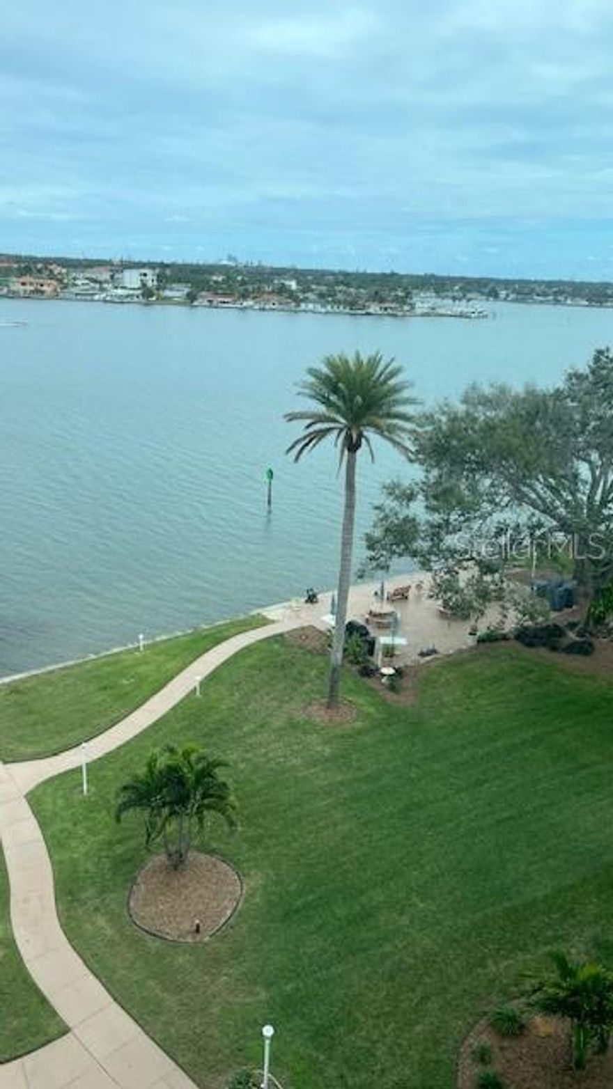Don’t miss this opportunity! Very competitively priced, large 1 bedroom, 1 bath waterfront condo in beautiful South Pasadena overlooking Boca Ciega Bay. Be a part of this 55+ active community and enjoy plentiful on-site amenities including two heated swimming pools, two fishing piers, clubhouse, fitness center, shuffleboard courts, community gas grills, and kayak racks.

The unit is located on the 7th floor, allowing for breathtaking views from both the front and back of the unit. Flooring in the living room, dining area, and Florida room features upgraded 24 x 24 porcelain tile, while the large primary bedroom is carpeted.

The kitchen offers white vinyl cabinetry with ample storage, along with a peninsula island featuring an upgraded granite countertop. The A/C system was replaced in 2024.

The Shore Crest community association is responsibly managed and up to date with all state-required inspections and funding. The roof was replaced in 2025, eliminating concerns of a future roof assessment.

This superior location places you less than 1 mile walking distance to charming Corey Avenue restaurants, bars, and the popular Sunday morning market. Beaches are just minutes away, and downtown St. Petersburg is less than a 15 minute drive.

Don’t miss this opportunity to own a piece of paradise.