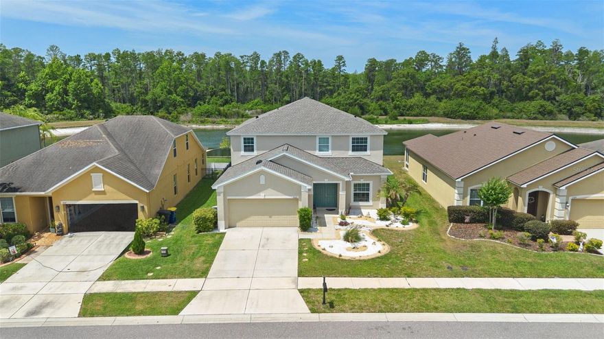 Fantastic Pool home on pond and conservation lot in the sought-after community of Dupree Lakes. This meticulously maintained residence offers over 3,200 square feet of thoughtfully designed living space,  featuring a first floor primary suite, 5 total bedrooms, 3.5 bathrooms, a sparkling saltwater pool, and upstairs bonus area. Manicured landscaping make a striking first impression. The home also includes a spacious 2-car garage, offering plenty of storage and parking.  Spacious open kitchen with breakfast bar, oversized pantry and center island. The open-concept design continues into the spacious living area with large windows allowing plenty of natural light and frame breathtaking views of your private outdoor retreat. The entire interior has been freshly painted, giving the home a bright and modern feel. Just off the main living area, you’ll find a convenient half bath perfect for guests. The primary suite is a luxurious escape, a spa-inspired en-suite bath. Relax in the garden tub or rejuvenate in the walk-in shower.  Upstairs, a versatile loft offers the ideal space for a media room, playroom, or home office. The secondary bedrooms are all generously sized and thoughtfully designed, each featuring beautiful bamboo flooring and walk-in closets. A Jack-and-Jill bathroom with separate vanities adds both convenience and function to the back bedrooms. Step outside and discover your private backyard oasis. Open pool area allows unobstructed views of sunsets over the conservation area, a resort-style solar heated pool complete with fountain—perfect for lounging on warm Florida days. Entertain with ease under the covered outdoor kitchen and patio area—ideal for weekend cookouts or evening gatherings. Dupree Lakes residents enjoy access to a resort-style clubhouse, lighted tennis courts, basketball courts, a soccer field, and play area. Sidewalks line both sides of every street and stretch along each side of Dupree Lakes Blvd, making it perfect for strollers, joggers, and evening strolls. With convenient access to Collier Parkway to the southeast and Ehren Cutoff to the northwest, commuting to major county roads and interstates is a breeze. This stunning home is perfectly located near shopping, restaurants, and top-rated schools. Truly a must-see opportunity in one of the area's most desirable communities of Land O’ Lakes.